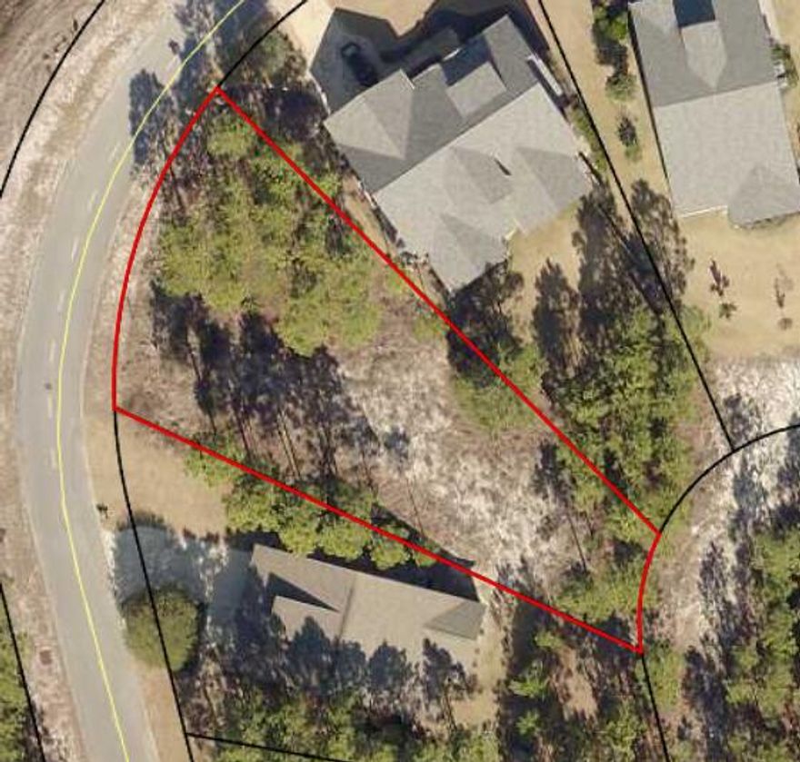 Lot peeks over Fairway 3. Wild Heron is located on the Shores of Lake Powell, a large Dune Lake. It is the Home of Greg's Norman's Shark's tooth Golf Course. Some of the amenities include are a fully equipped fitness center, boat house with kayaks, Event Lawn, fire pit, heated pool with hot tub, hiking trails and playground. You are minutes away from  Pier Park and 30a shopping and dining, but far enough away from the noise. All Dimensions should be verify by the Buyers. Covenants and Restrictions are on the Wild Heron website. **Tennis and Golf Course require an additional fee.