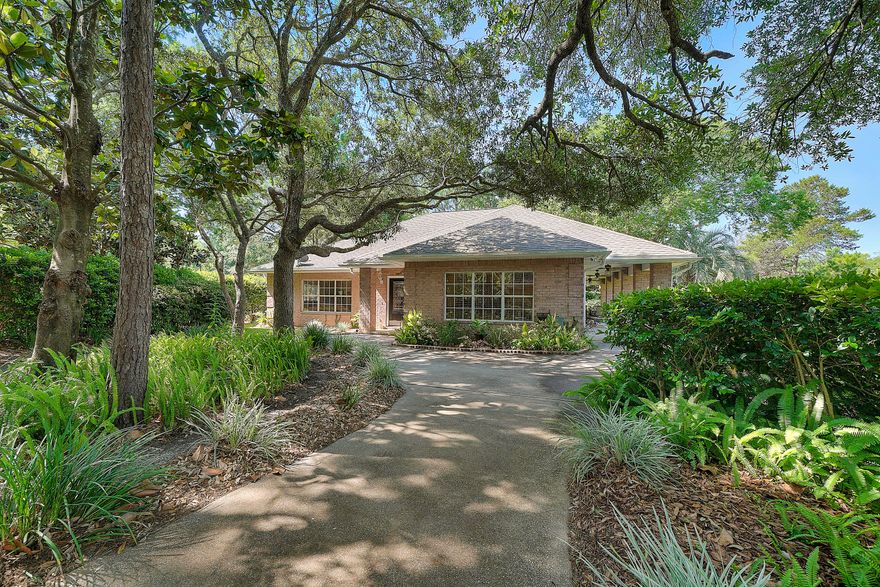 French Countryside architecture awaits you in this secluded cottage in the heart of Southwind. You will appreciate the fine attention to detail that the present owners have taken in this one of a kind home. Two large master suites with separate showers and double bowl sinks. Open concept throughout the home with beautiful cabinetry and lots of storage Pull out drawers in kitchen and a island where entertainment can begin. Large pantry for overflow storage The exterior is secluded and yet the views of the golf course remind you that you are in one of the most distinguished parts of Bluewater Bay. Ample room for a pool with separate seating areas through out this wooded piece of perfection. Fire pit and screened in porch just add to your enjoyment.. Easy show with a little notice