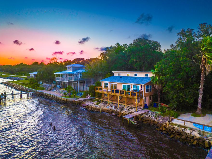 Welcome to your waterfront oasis! Whether you're drawn to the stunning views, the potential for income generation, or both, 14533 W ST HWY 20 A-B presents a rare opportunity to own a piece of paradise. You can live in one unit while renting out the other, generating rental income to offset your investment!  The roof and both A/C units were replaced just 2 years ago. The duplex offers direct access to the water, allowing you to indulge in boating, fishing, and waterfront activities right from your doorstep. Situated along the serene shoreline of the Choctaw Bay, this property boasts two spacious and meticulously designed units, each capturing the essence of bayside living. Each remodeled unit features an open-concept layout, designed to maximize space and offer seamless indoor-outdoor liv ing. Large windows flood the interiors with natural light while offering unparalleled views of the water. The kitchens are equipped with modern cabinetry, granite countertops, stainless steel appliances, and contemporary fixtures. Enjoy alfresco dining, entertaining, or simply relaxing on the deck. With ample parking space available, accommodating residents and visitors is a breeze. The property's prime location offers easy access to local attractions and amenities. Don't miss out on the chance to experience the epitome of waterfront living.  Schedule a private showing today! The single family residence located just next door is available for sale as well, and also offers an opportunity for income generation. MLS #924907.