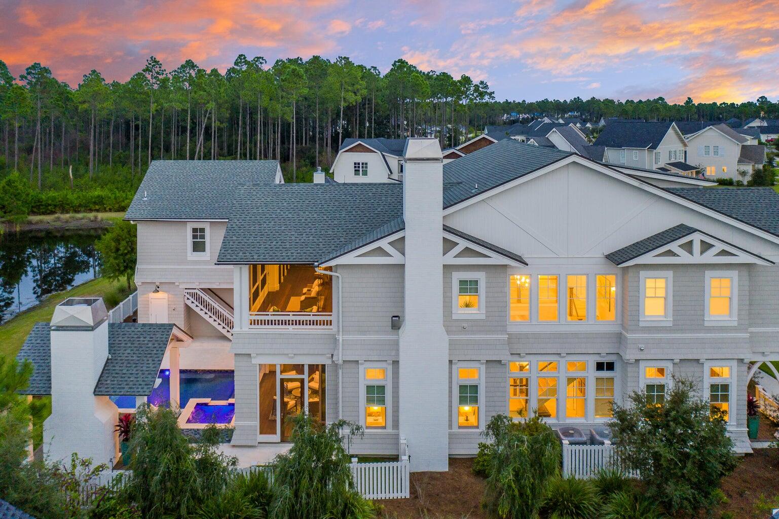 As you approach this stunning estate, the grand entryway gives you a glimpse of what awaits beyond the welcoming mahogany doors. This opulent home also features a one-bedroom carriage house which is perfect for multigenerational living or a private guest space. Encompassing five bedrooms, five bathrooms and two half baths totaling 4625 square feet.Every detail of this expansive Chris Stoyles, Turner Legacy custom home has been thoughtfully curated. From the imported Marquis cabinetry, kallista sinks, euro doors, automated window treatments, $100,000 in upgraded elevated AV system with sound wired inside and out, cell boost in every room, GENERAC generator, separate cabana with outdoor fireplace and pecky cypress mantle, infared heaters, media center, heated infinity edge pool, and spa