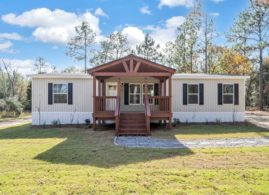 Welcome to Turkey Creek Woodlands! Seller is offering up to $10,000 towards buyer closing costs! Home warranty is included! The lots are over 1 ACRE! A large custom covered porch adorns this NEW 2023 Clayton Explorer home! The home perfectly combines elegance and functionality. This 3/2 top-of-the-line home comes with a modern, open-concept floor plan boasting 1,475 square feet of living space. This home was designed for comfort and convenience, built with the highest-quality materials and meets strict energy-efficient standards. Features include Duracraft cabinetry, Frigidaire appliances and Shaw(r) Laminate Flooring. Save thousands on utility bills with a well and septic tank! Conveniently located within 30 minutes to most of the military bases and Crestview/DeFuniak! Call today!