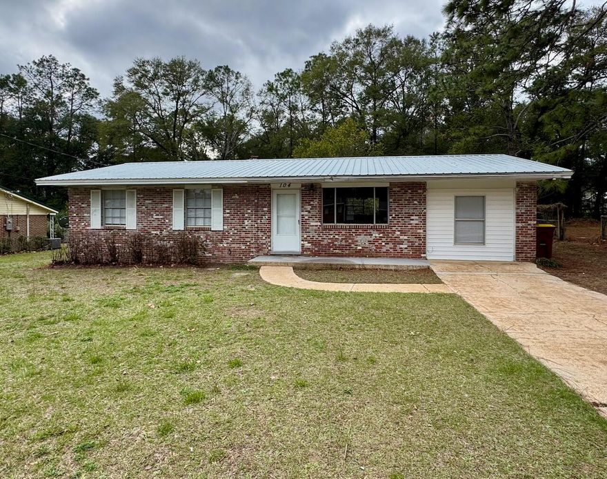 This charming single-family home at 104 Camellia Place in Crestview, Florida, offers comfortable living in a peaceful neighborhood. Built in 1965, the residence features 3 bedrooms and 1 bathroom within approximately 1,352 square feet of living space. The property sits on a spacious 10,753 square foot lot, providing ample outdoor space. The interior boasts a combination of new carpet, laminate vinyl plank, and tile, large tiled bonus room. laundry hookup, offering a blend of comfort and practicality.