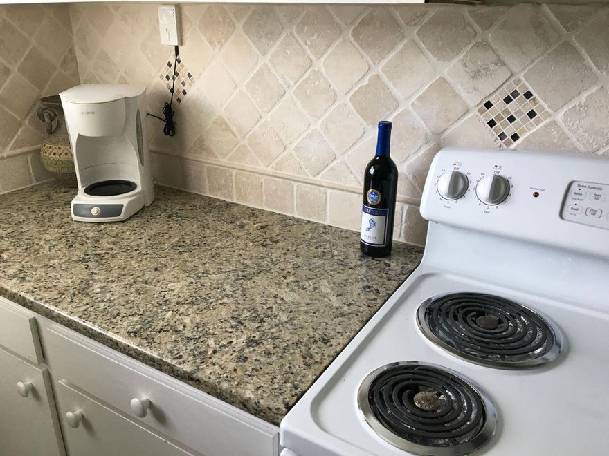 End unit now available at South Bay SOUTH site near the Gulf. This spacious 2 bedroom is the same sq ft as most of the 3 BR units (1289) Easy remodel conversion to a 3 BR as many have been done previously. Parking is just outside your front door, and just a short stroll to the beautiful private beach. The exterior of the buildings are due to be painted to match the grey color to match the north site buildings. This will be at association expense from reserves.  South Bay is centrally located in Destin close to restaurants, shopping, and family activities. There are two full size swimming pools, two tennis courts and a fishing lake on site.