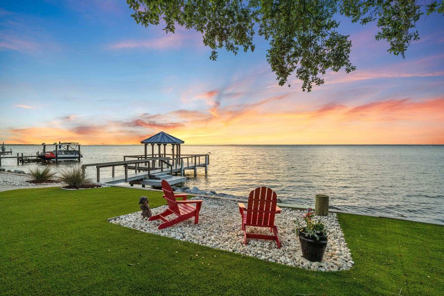 Experience luxury coastal living in this stunning 4-bedroom, 2.5-bathroom, 3 car garage home nestled on a spacious 0.8-acre waterfront lot on the beautiful Bay in Destin. Boasting 3,091 sq ft of high-quality construction built in 2012 with hurricane-resistant design and numerous upgrades throughout this property offers the perfect blend of comfort, style, and functionality. Enjoy breathtaking panoramic bay views from your own backyard, complete with a private boat dock for direct access to the water. The home features a screened-in, heated pool, ideal for year-round relaxation, and a fully fenced yard that ensures privacy and security. Property also includes beautiful mature trees and recent landscaping upgrades with synthetic turf for low maintenance appeal. Inside, you'll find a geothermal HVACsystem (2022) for energy efficiency, a 3-car garage with A/C, and a Generac full-house generator for peace of mind. Additional highlights include boat and RV parking, a detached storage shed, and plenty of room for entertaining both indoors and out.
Conveniently located in a neighborhood where there is no HOA, short term rentals are restricted and this home offers residential environment, free from the frequent turnover of transient visitors. This home is just 1 mile from Destin Harbor's top dining, shopping, 1 mile to the nearest public boat ramp, 10 minutes to the Destin Executive Airport and less than a mile to the famous Crab Island, this home places you at the heart of everything while offering a private waterfront retreat.
Don't miss this rare opportunity to own a premier bayfront property in one of Florida's most sought-after coastal communities with No HOA or Deed Restrictions.

