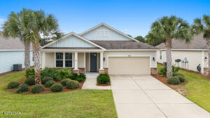 Introducing a remarkable home in the desirable Whispering Dunes on Panama City Beach! This stunning three-bedroom, two-bath residence offers 1,924 square feet of beautifully tiled living space.The Primary Suite has plenty of room with Trayed Ceilings and 8 Foot door. With A Bathroom with Double Vanity and Matching Granite thoughout.Nestled in a golf cart-friendly community, this property features an HOA-landscaped yard and access to a luxurious community pool. The kitchen is beautifully designed with granite countertops and stainless-steel appliances, providing a perfect setting for culinary creativity. Extra shelving throughout the home ensures ample storage space.Relax on the automatic roll-down screened patio, a perfect spot for unwinding or entertaining guests, with th