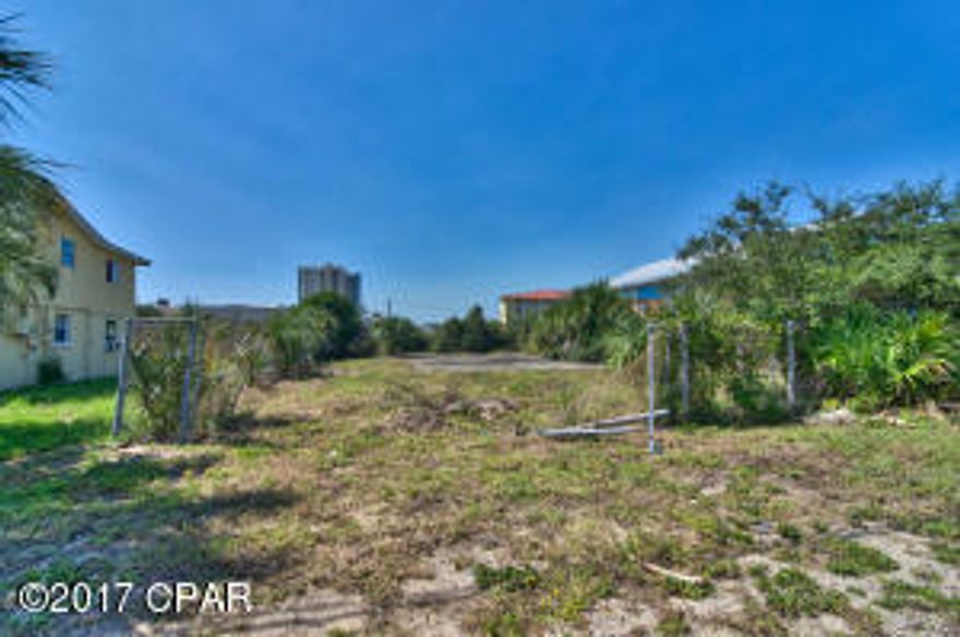 Terrific building lot with a mix use zoning. Terrific location zoned R-2 meaning, short term rentals are ok and duplexes are ok. Confirm with planning and zoning about types of businesses that are approved. Regardless of the use the location is awesome only 2 blocks to the beach. Also close to Pier Park, Restaurants and local attraction