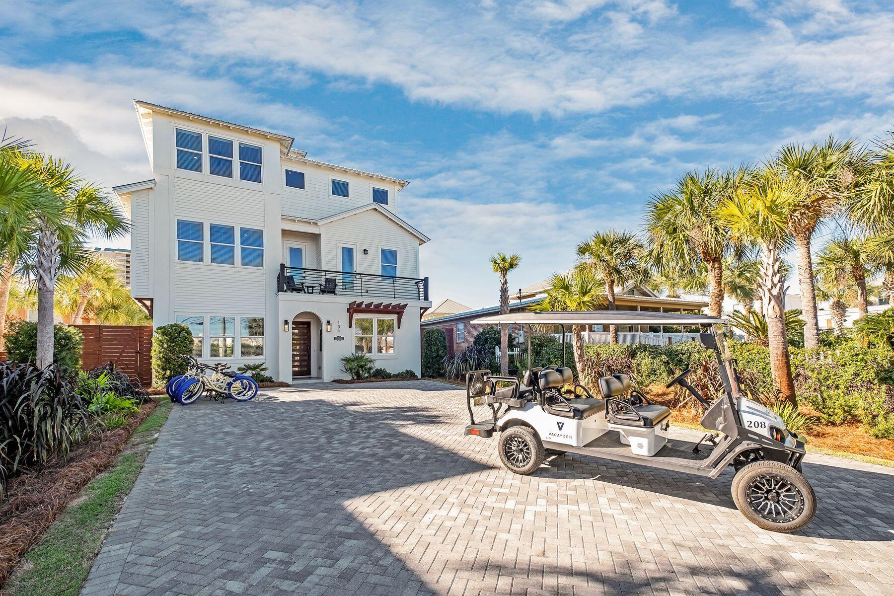 Stylish and spacious, this four-story beach house has ''vacation home'' written all over it. Sitting on a premium 50'x200' lot, it was completed in 2021 and is just five houses from the beach. Designed as an all-inclusive resort-style home, it has a private pool and serene gulf views from the rooftop terrace. It's the perfect place for sunset cocktails and social celebrations.  Bordered by privacy fencing and tropical landscaping, the enclosed yard has a gazebo and bar for social gatherings, concrete fire "bowls," an outdoor kitchen with grill, and a 50-in. outdoor TV for watching the game. Step indoors to find nine beautiful bedrooms including two bunk rooms, and no less than three separate living areas. There's space to relax, read, dine and chat while kids of all ages pocket balls on the Brunswick pool table. Sliding barn doors, a media room with a wet bar and 8.4 luxury bathrooms with oval tubs or walk-in showers provide comfort and luxury on every floor. Ideally located on the south side of Scenic 98, this well-planned home is designed for a Florida lifestyle. The first floor delivers a seamless flow through colossal glass doors connecting the indoor living space with the outdoor lanai, terrace and heated pool. An elevator serves all floors, including the rooftop terrace. Head up to the second floor, where a gourmet kitchen awaits. It's entirely designed to cater for large parties with a 48-in. Viking 5 gas range with pot filler, dual Viking dishwashers and floor-to-ceiling custom cabinets. The sleek kitchen island has four stools and is wrapped in quartz. It is complemented by an oversized dining table that seats another 12 hungry diners beneath a chic dandelion chandelier. The dining area leads onto a spacious L-shaped balcony with seating for another eight at a Seaside Casual dining table. Thanks to the incredible linear fireplace, this sensational space can be used in all seasons. The third floor is a dedicated sleep space, while the fourth floor has the ultimate open-air living space for enjoying the sights and sounds of the Gulf of Mexico. It includes another linear fire pit, a 30-in. built-in Lynx grill, bar with seating and a 50-in. TV. For guests, this is a luxurious vacation paradise, while for owners, it offers a projected annual gross revenue of $240,000.

