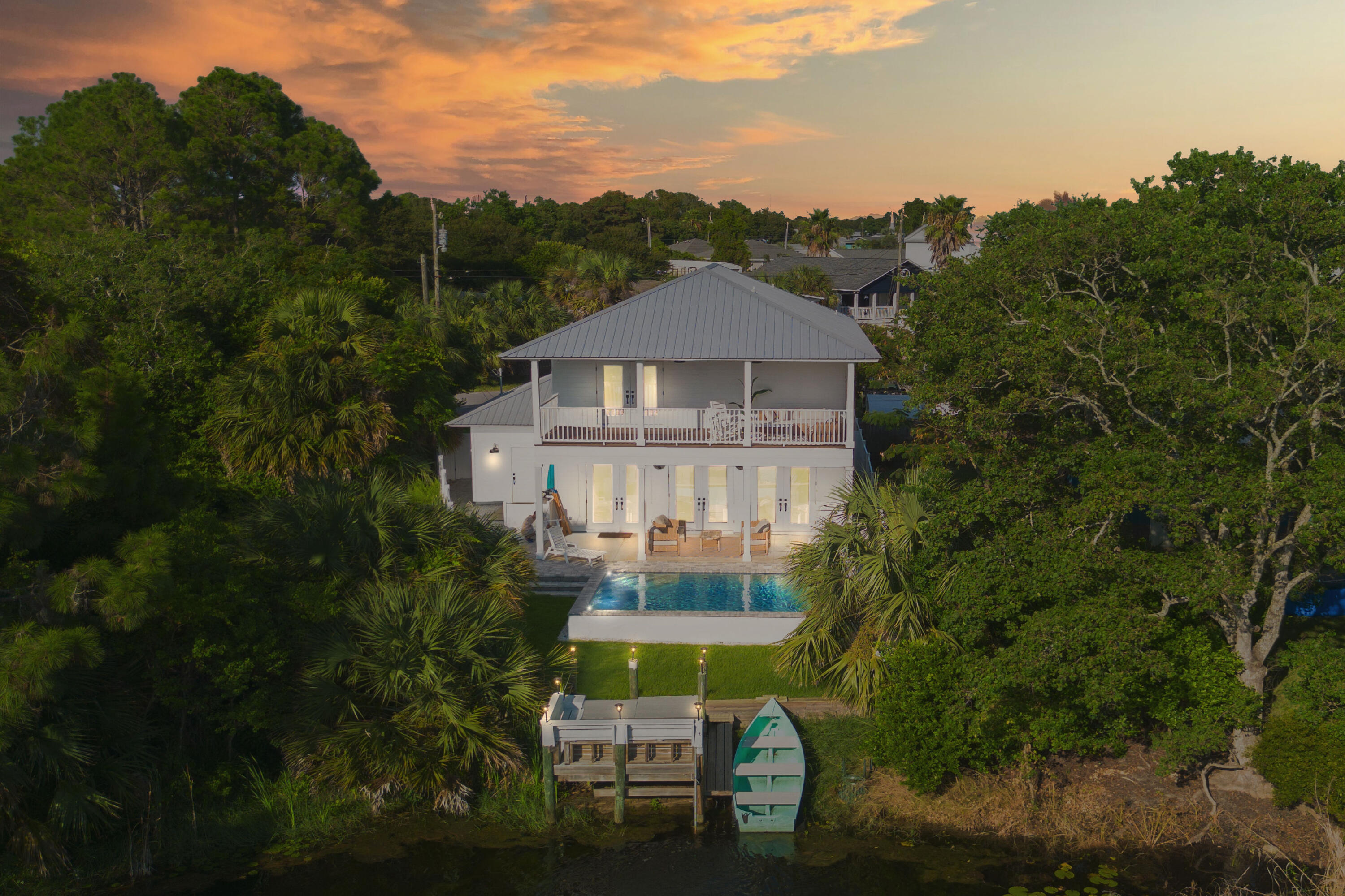 Step into luxury and relaxation at a newly renovated, two-story home in the tranquil Laguna Beach area of Panama City Beach, Florida. Just a short 2-minute walk from the stunning white sand beaches, this 4-bedroom, 3-bathroom home promises a memorable stay for families or groups of friends. Whether you're soaking up the sun by the brand-new private pool, exploring the freshwater lake from your dock, or enjoying the beauty of the Gulf's sunsets, this home offers everything you need for a perfect beach getaway. Location is everything, and this has it all. Located just two blocks from multiple public beach access points, your toes will be in the soft, sugar-white sand in no time! Spend your days lounging by the pool, hunting for seashells on the beach, or fishing from the dock!