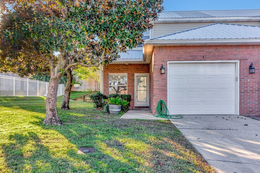 Fabulous end unit right next to the pool with a rear covered porch....perfect for relaxing at the end of your day! Beautiful laminate flooring and tile downstairs and real heart-pine wood flooring upstairs. No carpet to vacuum or clean! The living/dining/kitchen combo is open concept. The kitchen features subway tile backsplash, a pantry, and an awesome brick accent wall. There is a large guest bath just off the kitchen that also houses the laundry area. A single car garage, under stair storage and beautiful covered patio round out the first floor. Upstairs are two generous bedrooms each with its own en-suite!Don't miss out on the opportunity to make this house your own - schedule a viewing today! Call 850-729-0399 View rental requirements or apply at www.RentwithBSR.com