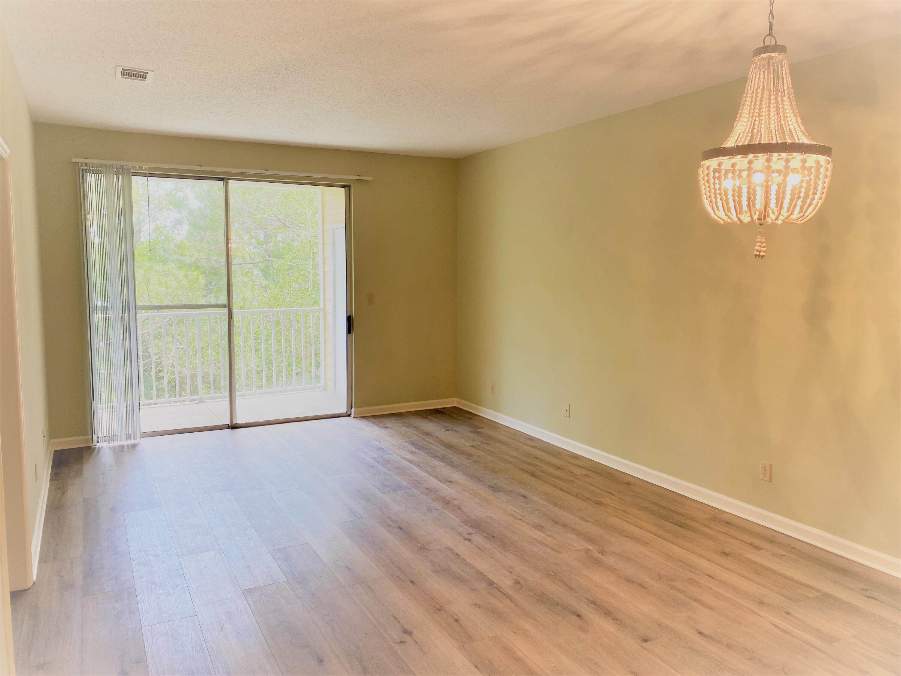 Beautifully remodeled third floor condo with spacious 9 foot ceilings. Short term rental projections up to $43,000. Balcony looking out at the trees full of squirrels and birds to entertain you. New wide plank LVP. New granite kitchen countertops. New top of the line stainless steel deep sink. New stainless steel dishwasher and new larger size stainless steel refrigerator. New disposal. W/D included. Upgraded bathrooms. NO CARPET. Great location by Grand Blvd shopping. Walk to Starbucks. Beach access nearby. Bike over to the Sandestin and enjoy the resorts' tennis, golf course, marina and shopping. Short and long term rentals allowed.