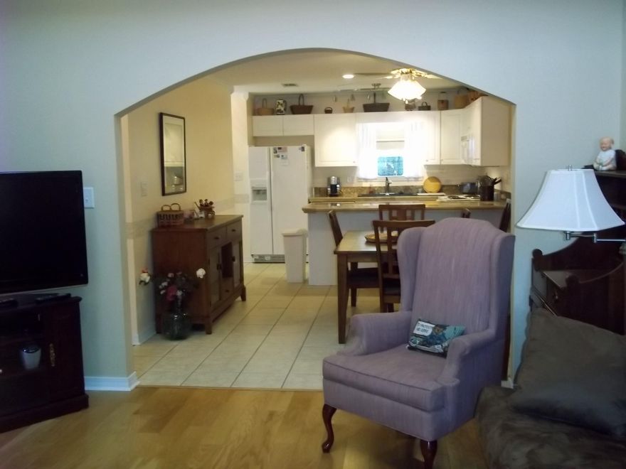 A lovely home and a great neighborhood. Ground floor master bdrm. Large Mtr.bath, dbl. vanity, sky light. Sliding door on to the deck in this BR. Suite. Very high ceiling in the Living Room. Wood laminate flooring in the Living Room. Dble Garage off of Living Room. Lotsa closet space, the attic area is large and a lot of flooring off of 3rd bedroom. A Jack & Jill type bath room between the 2-upstairs bedrooms. Kitchen has tile type ctr.tops., breakfast bar. decorative lighting, all amenities you want in a kitchen. Laundry room off of kitchen. Door out to the deck from the kitchen. New ceiling fan on deck.