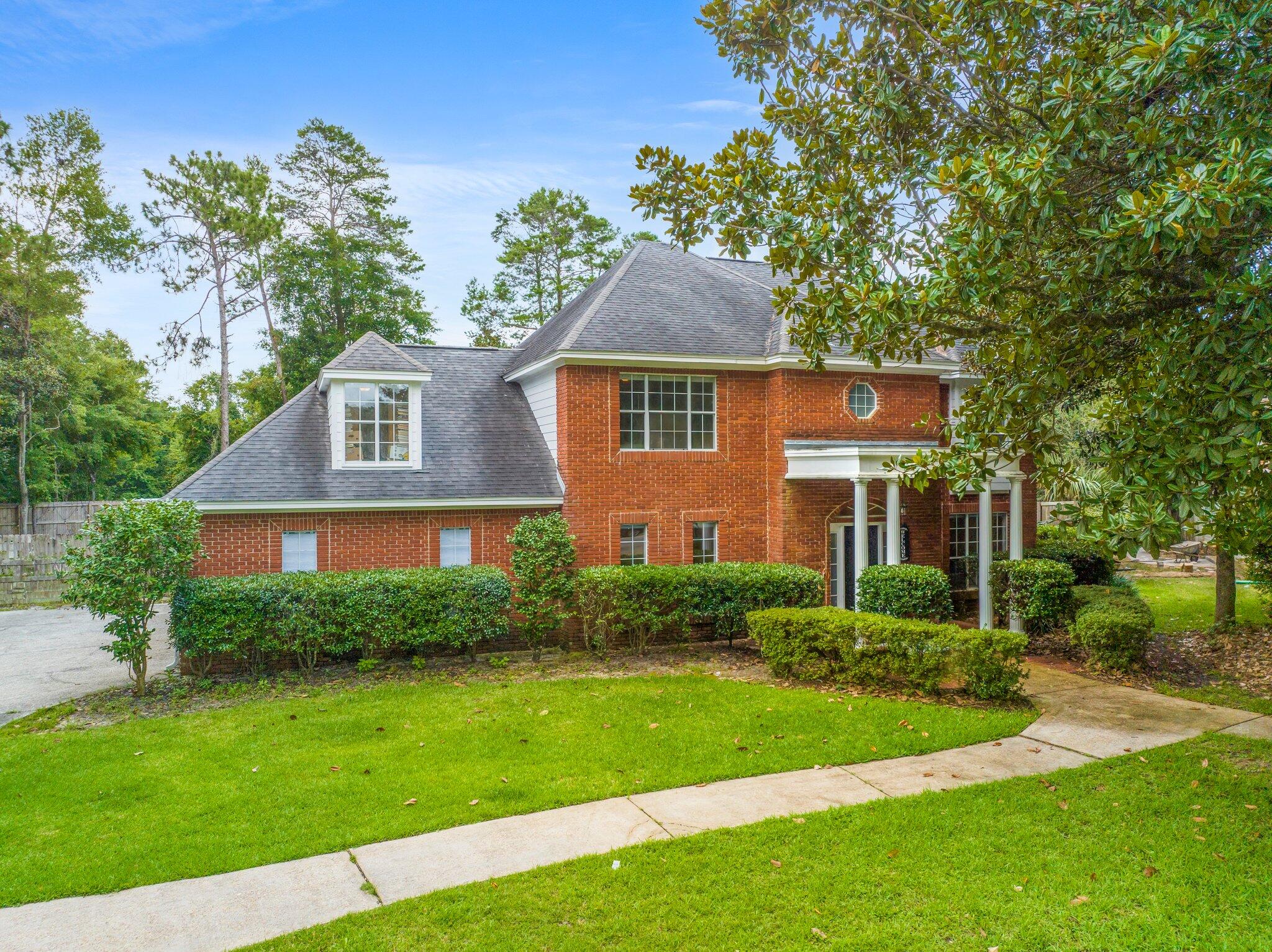 Motivated Seller! This home is so amazing and needs a great family! The elegant foyer boasts a Grand staircase with vaulted ceilings, new LVP flooring and professionally painted walls throughout. Luxury chef style kitchen features high end appliances, quartz counter tops and custom cabinets. The first floor offers a dinette area, formal dining room, half bath and sitting room in addition to the main living room with a gas fireplace and Florida room. Upstairs features four cozy bedrooms w plush carpet, walk in closets and lots of natural light. Bathrooms include: jacuzzi tub, shower, custom counter tops and tile floor. Enjoy the backyard landscaping, manicured lawn, screened pool enclosure with oversized pool and hot tub, outdoor shower.