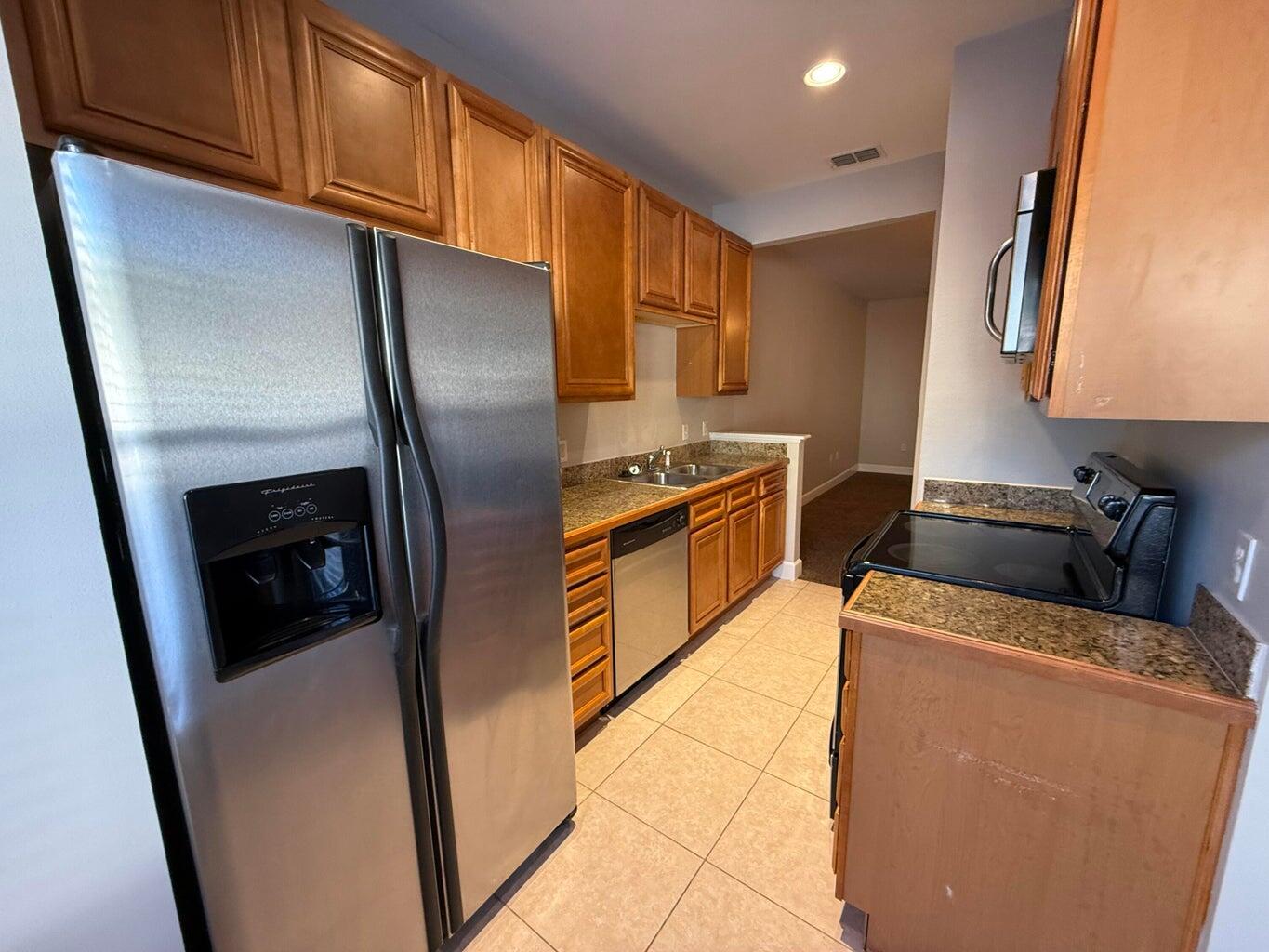 Take a look at this 2 bedroom 2.5 bath townhouse at the Palms of Freeport, featuring a community pool and picnic area. The downstairs has a spacious living area, kitchen and small breakfast nook area. Tile & hardwood floors throughout the downstairs. There is a half bath located on the main floor, perfect for guests. A storage closet under the stairwell. Master bedroom has LVP flooring, new blinds, new ceiling fan, double closets, with a ensuite bathroom includes Guest bedroom has LVP Flooring, new blinds & ceiling fan. Porch has an electric retractable awning for shade on sunny days! Located across from the elementary school and within five minutes of the middle school and high school. Washer & Dryer Included.