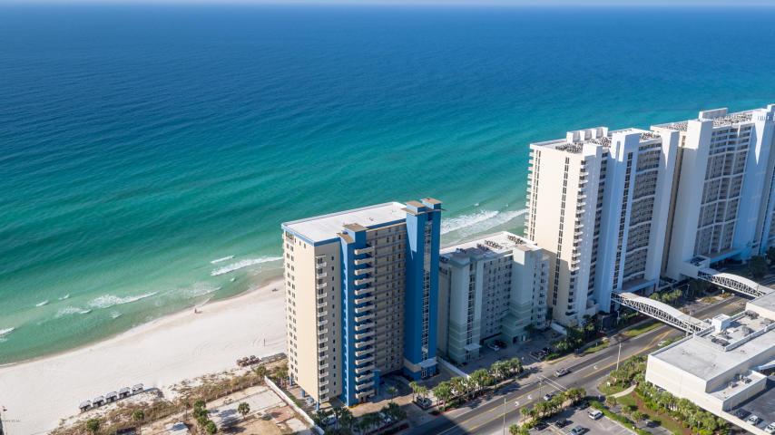 Gulf Front 3BR/2BA condo on 1st floor. Enjoy the sandy white beaches & emerald coastline beauty right along with spectacular sunset views from your own gulf front balcony, accessible from the living area & the master suite. Open floor plan. Granite countertops in kitchen & bathrooms, crown molding, super large laundry room with extra storage closet. Updates include: Backsplash, stainless appliances, dining table set & bar stools, artwork, tv stands, bedding & accessories, ac & hot water heater. Grandview East is a low density complex that went through major renovations in 2016. New gulf front windows & sliding glass doors, complex repainted, lobby updated & enclosed walkway to pool added. Complex is beautiful. Located in the center of Panama City Beach close to the best restaurants, Walmart, entertainment & just a few short minutes to Pier Park Shopping. Don't miss out on this one!