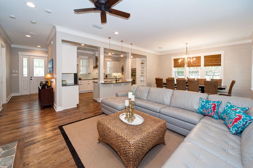 An inviting circle drive dappled in sunlight passes under lush live oak canopies to reach the screened front porch of this Seagrove Beach home. Room remains on its double lot, measuring over a quarter of an acre, to add a pool or a carriage house. Peaking over the treetops is a four story observation tower with unimpeded views in all directions encompassing a beloved coastal dune lake and the Gulf of Mexico, access to which is approximately 250 yards away. In this relaxed area south of Scenic Highway 30A, you will enjoy a eclectic ''Old Florida'' atmosphere absent of homeowner association fees. Breezeway roof to the detached two-car garage. Wide cut wood floors carry throughout the open first floor living areas with cottage panel walls, as well as the convenient first floor master bedroom.