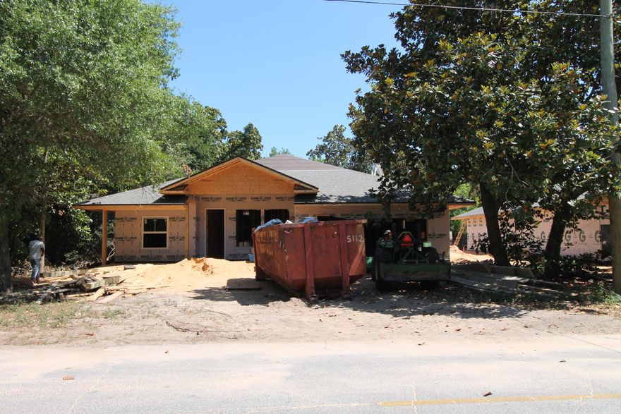Awesome new floor plan by multiple award winning builder, and past Parade of Homes award winner! This 4/3.5 custom brick home has super curb appeal. There will be 10 Ft. Ceilings w/ impressive crown molding, hand scrapped hardwood flooring, and 5 1/4'' baseboard throughout the main living areas. As you approach the front of the home, you will be quite impressed. The covered porch is very welcoming, and the gorgeous leaded glass door makes for a grand entrance. The formal dining room is at the right of the home's front. Just past the dining room, you will then enter the chef's delight kitchen which will boast custom maple cabinetry, granite countertops, a wet bar with wine cooler, a  large pantry, and and stainless appliances (including an oversized commercial grade frig./freezer). At the left of the home's entrance is bedroom one, continuing down the hallway is the guest bath, then bedroom two. The oversized greatroom is in the rear of the home and opens to a covered porch, which is perfect for entertaining. The master suite is oversized, has 2 large walk - in closets, a linen closet, a walk - in shower, a whirlpool garden tub, and a double vanity. The laundry room is at the rear of the kitchen, and has a door which opens to the garage. The yard will be beautifully landscaped and comes complete w/ a well, sprinkler system and timer. Home has a Taexx ''in the wall'' pest control system that is accessed from the exterior of the home for the owner's convenience. The yard will be beautifully landscaped and comes complete w/ a well, sprinkler system, and timer.