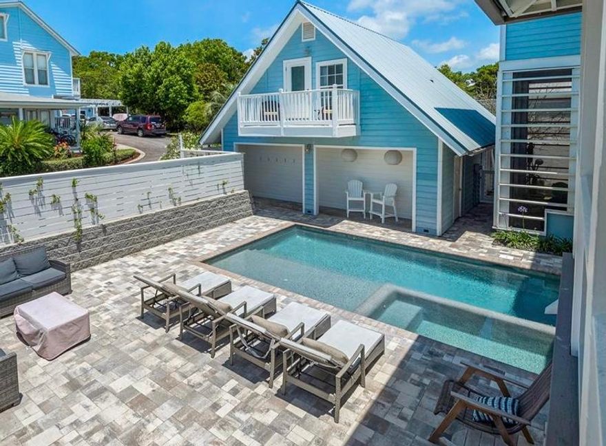 This stunning beach house with just under 4,200 sq ft of living space (6493 sq ft under roof) including the carriage house is just 2 blocks from the beach and perfect for entertaining. The main house includes 5 bedrooms, 4 bathrooms, a huge garage with 14' ceilings (big enough for an RV), open concept living areas and a brand new patio, heated pool, hot tub & outdoor shower. The gorgeous kitchen has stainless steel appliances, a large gas range, pot filler, walk-in pantry and wine cooler. The living and dining room offer space for the whole family to gather with a 72' linear gas fireplace. The carriage house is a free standing one bedroom, one bathroom apartment with a full kitchen. The property received a major renovation in 2021 to become a highly desired vacation home. No HOA!!!