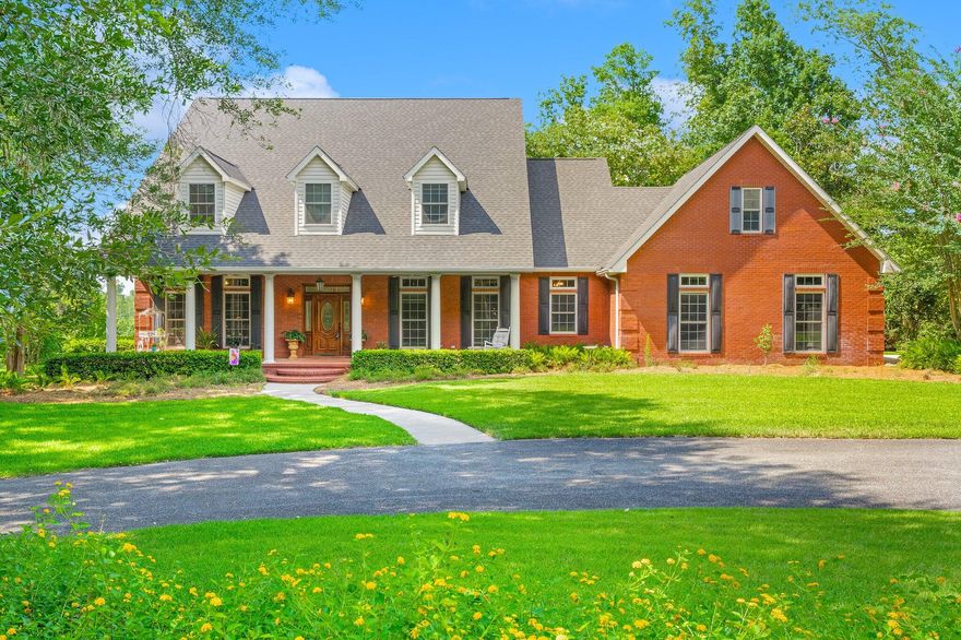 UNDER CONTRACT; SELLER ACCEPTING SHOWINGS AND BACKUP OFFERSThis custom one owner home, perfectly situated, on arguably the most beautiful, private 4 acres. At the bottom of the property you'll enjoy the waterfront living off of your private dock on Merritt's Mill Pond. Step inside this 5 Bedrooms, 3.5 Bath home with Office, to discover a beautifully designed interior with features such as coffered ceilings, crown molding, and built-in bookcases. The kitchen is a chef's delight with a kitchen island, pantry, double oven, gas cooktop, and stainless steel appliances. Enjoy the convenience of a First floor spacious primary bedroom. It boasts a luxurious en-suite bathroom and ample closet space. The private split floor plan allows the additional 4 bedrooms to be upsta  productivity. Or study time in the Home Office.  Outside, a spacious porch for outdoor entertaining, even a gas hook up for your grill. Looking out you'll see rolling green grass, and down below you'll find a dock for enjoying the water.The property also includes a 2-car attached garage and lots of additional driveway parking. Don't miss out on this incredible opportunity to own a waterfront oasis in Marianna. Schedule your private showing today