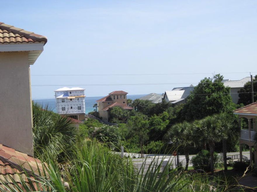 HUGE REDUCTION - BEST KEPT SECRET ON 30-A - LAS PALMAS MEDITERRANEAN VILLA, GATED WITH GULF VIEWS. Across the street from the beach with it's own secluded beach walkover, this sensational 4 bedroom 3 1/2 bath 3 story beach home has a beautiful first floor master with jetted tub and dual sinks. The gourmet kitchen boasts all stainless appliances, granite tops and a tumbled marble back splash. The separate dining room is spacious as is the adjacent living room with a rear door leading to an amazing large rear walled patio with resin wicker outdoor furniture, gas grill and lanterns. Two additional bedrooms and bath are on floor 2 and a large den, plus bunkroom and bath on floor 3. This is a MUST SEE! PRICED TO SELL!