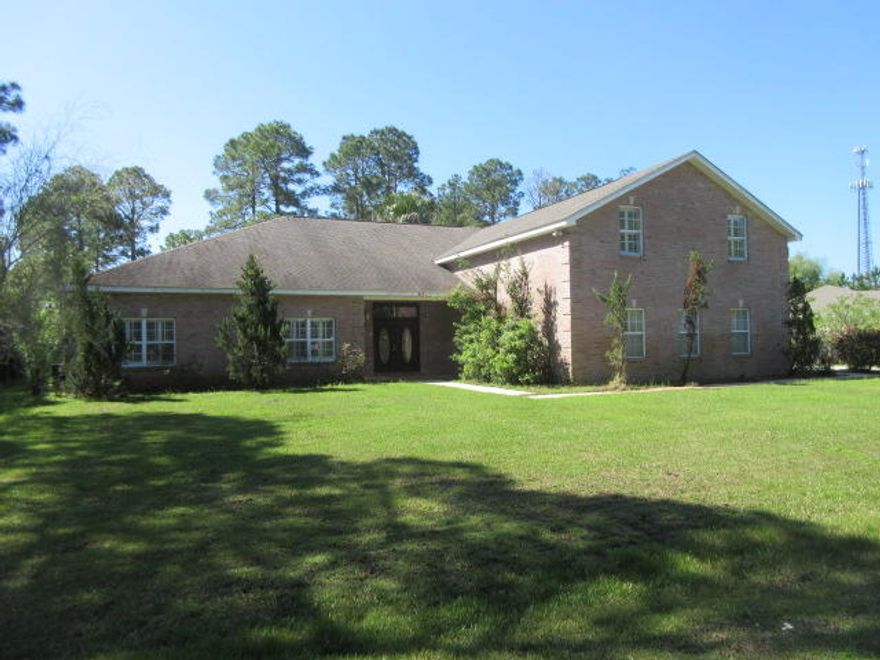 What an amazing opportunity to own this brick 7 bedroom, 5 and a half bath REO home on .5 acre. This fantastic home has a screened pool, garage apartment, trayed and raised crown molded ceilings, bonus room with a wet bar upstairs and 4 huge garage bays that could be your dream home! The location is private but so close to shopping, bays, beaches, lakes, schools and employment opportunities. Employees or directors of JPMorgan Chase & Co. and its direct and indirect subsidiaries are strictly prohibited from directly or indirectly purchasing any property owned or serviced by or on behalf of JPMorgan Chase & Co. or its direct and indirect subsidiaries.