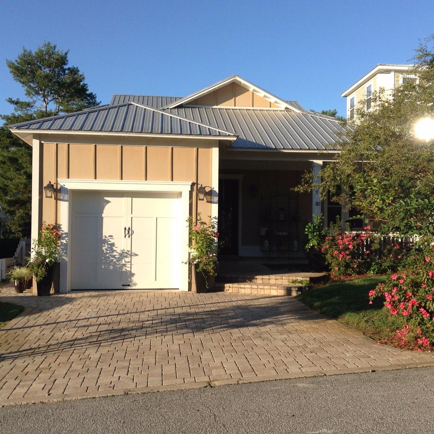 This impeccable ICF (Integrated Concrete Form) constructed home is located in a peaceful residential neighborhood of Blue Mountain Beach. It is conveniently close to restaurants, the state forest, the 30A bike/walking path, and a short bike or cart ride to the beach. Amenities include a gourmet kitchen with granite, stainless and stove with pot-filler spigot; gas fireplace with Venetian plaster surround; travertine floors; crown moulding, 10-foot coffered ceilings, open staircase, and a wall of glass windows with 8' sliding doors. The open-concept living space leads to a massive screened porch facing the lushly landscaped backyard. The home boasts a total of 500 square feet of screened porch and a tiled front porch of 100 additional feet adjacent to the single-car garage.