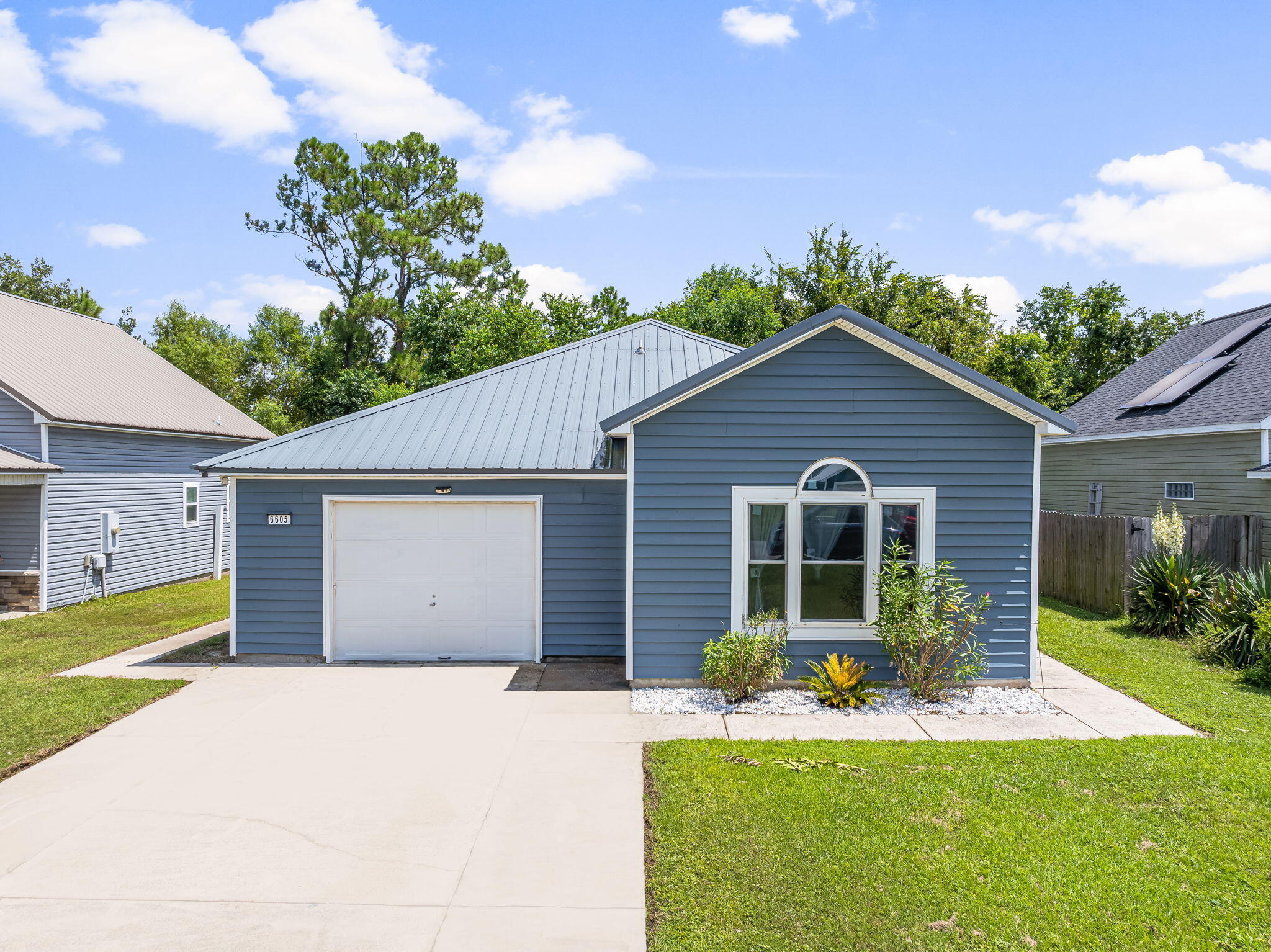CURRENTLY UNDER CONTRACT, SELLER WILL CONSIDER BACKUP OFFERS Welcome to this charming 3-bedroom, 2-bathroom home with a 1-car garage, located in the desirable SweetWater Village community. This well-maintained property offers a functional layout designed for comfort and convenience. not to mention an assumable VA loan! Step inside to find a bright and inviting main living area filled with natural light. The kitchen features a breakfast bar, ample cabinetry, stainless steel appliances, and a brand-new sliding glass door that opens to the patio--perfect for indoor-to-outdoor living.