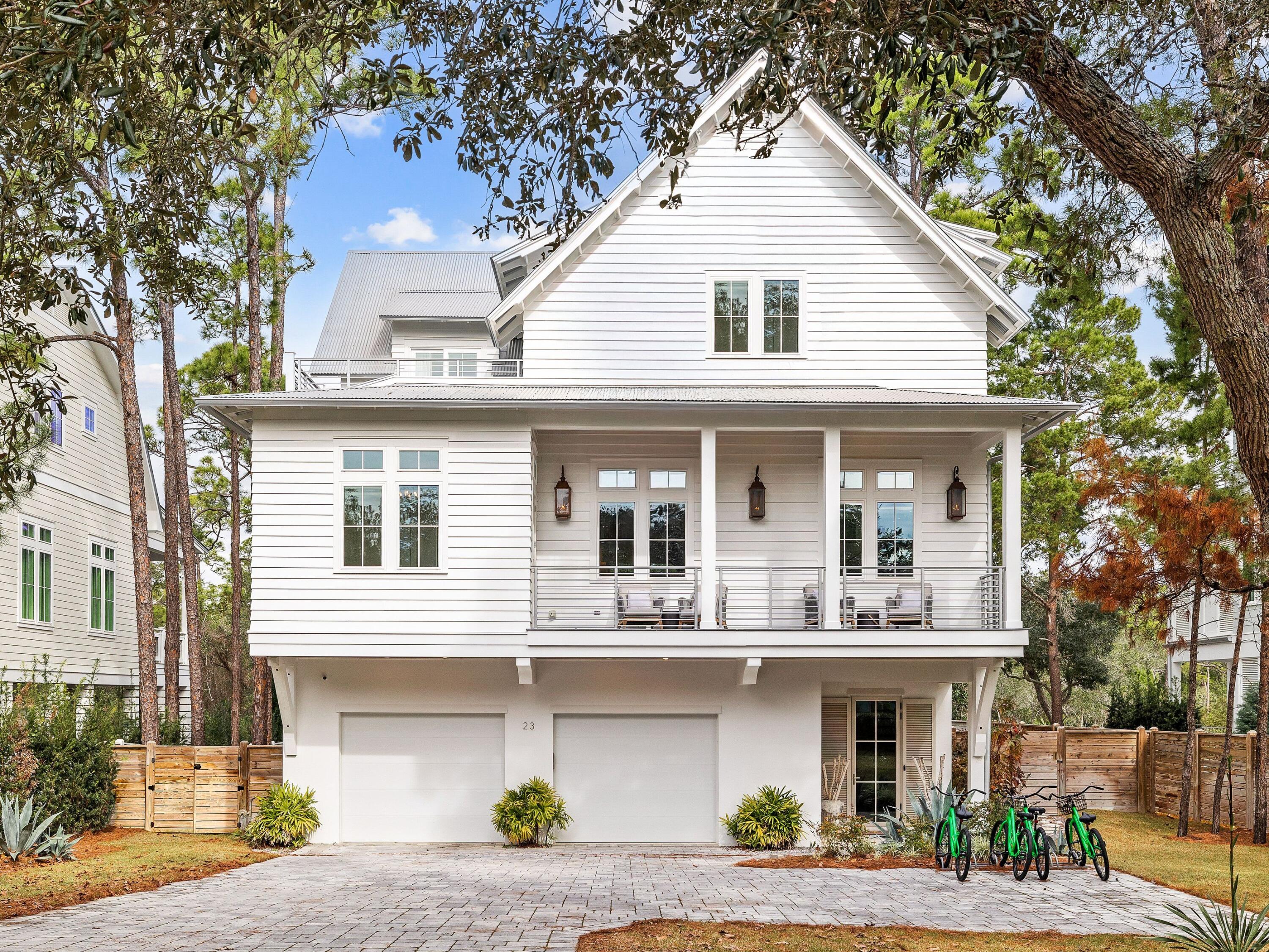 Located in the highly desirable Dune Allen Beach community along Scenic Highway 30A, this fully furnished coastal retreat offers a rare combination of upscale design, flexibility, and strong short-term rental potential--with no HOA restrictions. Whether you're looking for a luxury getaway or a high-performing income property, this one checks all the boxes. Set on a private, tree-lined lot, the home features 12-foot ceilings, floor-to-ceiling windows, and a light-filled open layout built for hosting and relaxing. The gourmet kitchen impresses with sleek white waterfall-edge countertops, a 48' dual-fuel range, top-tier built-in appliances, and an oversized island with seating for six. A dedicated home office just off the kitchen is perfect for remote work or quiet retreat. Designed with comfort and privacy in mind, the home includes two king primary suitesone on the second floor and one on the thirdplus two additional king bedrooms and a custom bunk room, each with its own private bath. The third floor also features a flex space, perfect for a media or game room. Three owner's closets provide ample secure storage for personal items. Just off the second-floor family room, doors open to a large elevated porch with a heated pool, lounge area, and fireplaceoffering the ultimate in outdoor living. In total, the home provides over 1,000 square feet of porch and patio space, including a ground-level covered living area with a fireplace, outdoor TV, dining space, and a fully equipped summer kitchen with grill, sink, and mini fridge. An elevator connects all three levels, and an oversized garage offers ample storage for beach gear, bikes, or golf carts. Ideally located near Gulf Place Town Center, top-tier golf, and the scenic trails of Topsail Hill Preserve State Park, this home offers both convenience and coastal serenity.