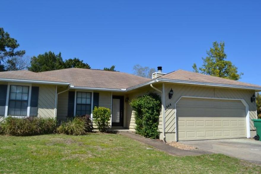 Situated in the beautiful subdivision of Gulf Manor, this Destin home is not one to be missed! Cherry wood and tile flooring in the kitchen and living areas for easy cleaning. Enjoy a cozy evening in front of the wood burning fireplace sporting a decorative wood mantle and tile hearth, plus the living room boasts a trayed ceiling, crown molding, and remote controlled lighting. The dining area comes equipped with decorative chandelier and opens to the wood deck. The kitchen features all black appliances with white cabinets. The large master bedroom features two walk-in closets, a separate vanity area, and spacious linen closet for extra storage. The two additional bedrooms are located across and down the hall and share the full bath with a cheerful skylight. Additional features include crown molding, a large fenced backyard with deck, and a two-car garage. This home is unfurnished. Tenant must set up the waste management in their own name. Neither the owner, nor ERA are responsible for setting up or paying for this utility. No smoking. No pets.