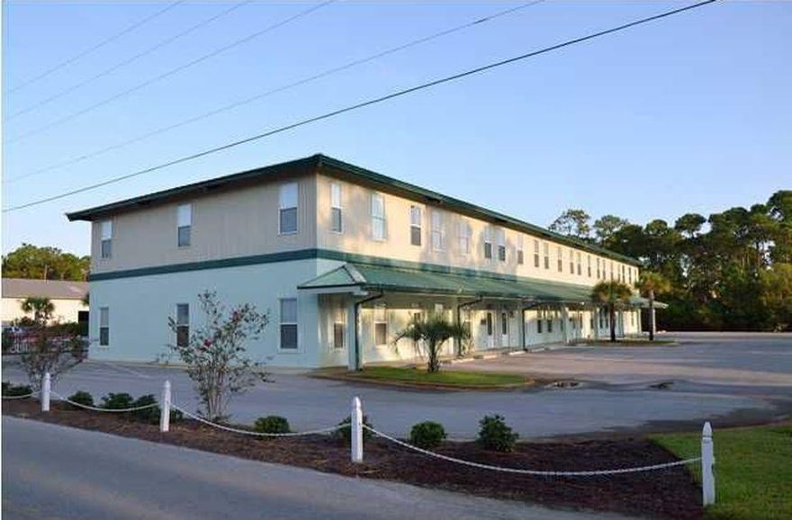 Impressive & unique commercial space in the heart of Miramar Beach. Located in the popular South Holiday Business Center, this desirable location is just a few short blocks from the beach and one block away from the highly traveled Highway 98. Easily accessible with a traffic light at the corner of Hwy 98 and S Holiday Rd.Just a short drive from all areas of the Emerald Coast. This unit is comprised of two generously sized floors, yielding 1,175 sf each & new wood plank floors will impress even the toughest of customers. A convenient rear service entrance, combined with an attached garage/warehouse area for ample storage makes this a one of a kind space that can accommodate many different business platforms. Zoned VMU.