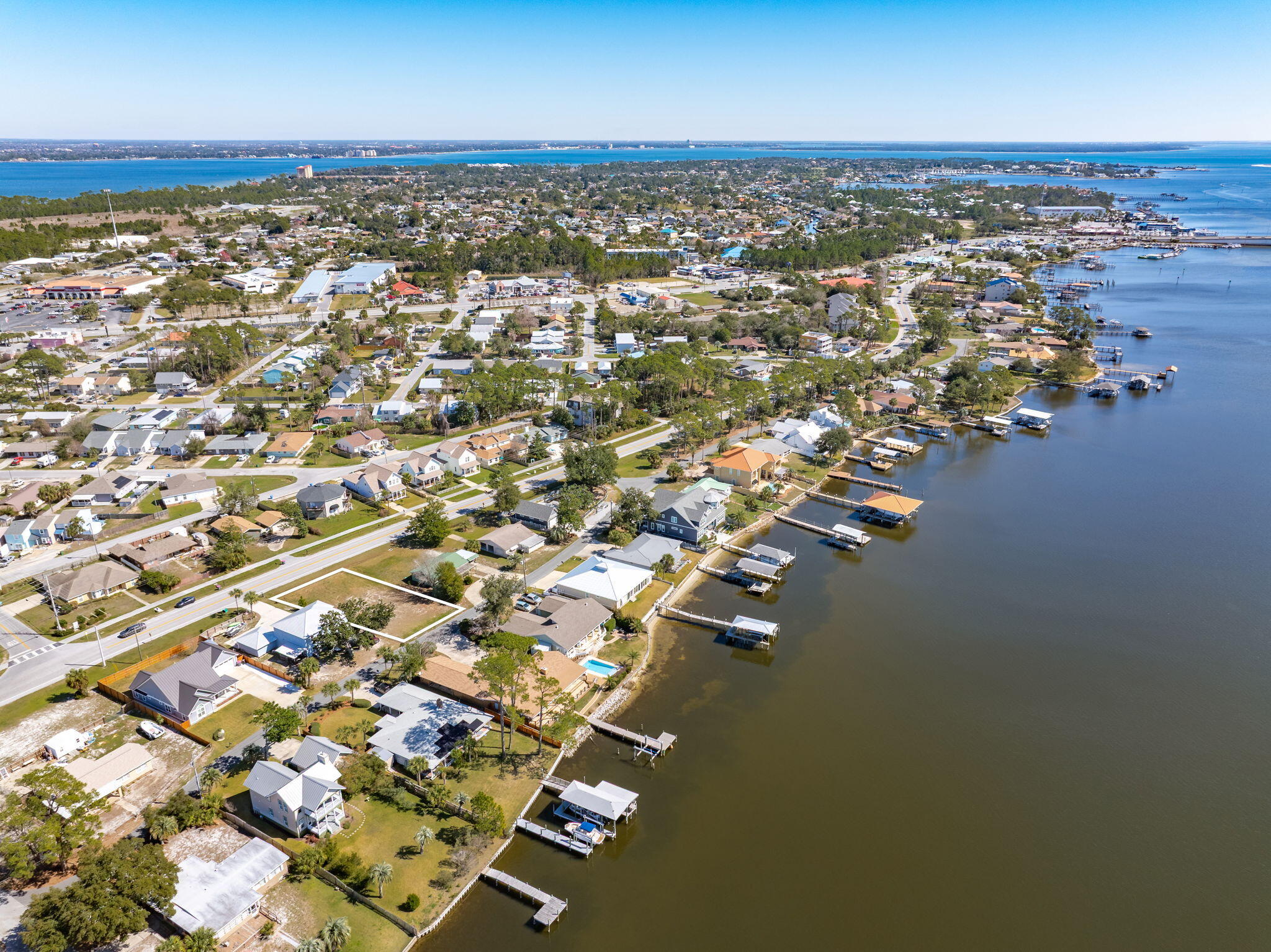 Welcome to your DREAM HOME location in the desirable North Lagoon area! This NO HOA 75 x 114 homesite offers the perfect setting for your new home. You will enjoy the most beautiful sunsets the area has to offer right off this READY to build lot!This homesite is just minutes away from local beach access points, including Saint Andrews State Park and the famous Jetties where the lagoon meets the Gulf. Enjoy boat rides to Shell Island, dolphin tours, and other water excursions. Plus, it's close to shopping, dining, grocery stores, spas, and more. This is an exceptional opportunity to own a slice of paradise in Panama City Beach, Florida! Don't miss out on making this beautiful homesite YOURS!