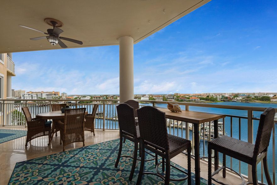 This exquisite 4/4 condo on Destin's harbor offers spectacular views and unparalleled luxury living.Completely upgraded, you will discover Wolf kitchen appliances, including gas cooktop, oven, microwave, coffee system, and steamer oven. Sub-zero refrigerator, granite counter tops, custom, cabinetry, and polished travertine flooring enhance the beauty and functionality of this gourmet kitchen. Sub-zero wine chiller, wet bar, and ice maker are perfect additions to this stunning kitchen space while enjoying the perfect coastal lifestyle.The living room boasts and open plan with a stunning custom fireplace which complements the high ceilings and exquisite crown molding.