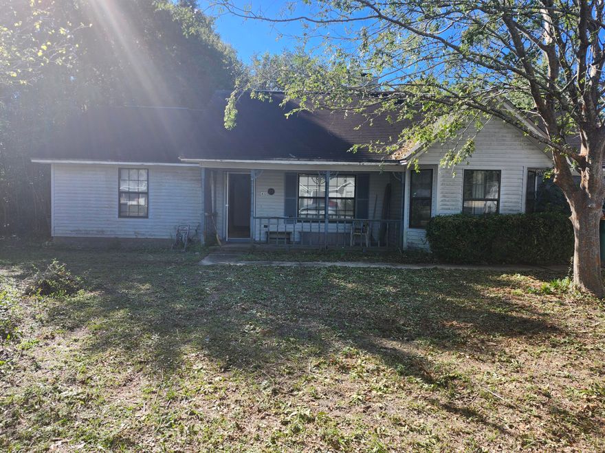 This charming 3-bed, 2-bath home offers 1,199 sqft on a generous 0.48-acre lot in Crestview, FL. Built in 1988, this property presents a fantastic value-add opportunity for a buyer ready to personalize their space. The kitchen features classic ceramic flooring, and the rest of the home is a blank slate, providing the chance to select your own floor coverings and custom interior color palette throughout. This residence is perfect for a new owner looking to infuse a home with their own style. The spacious yard adds to the appeal.