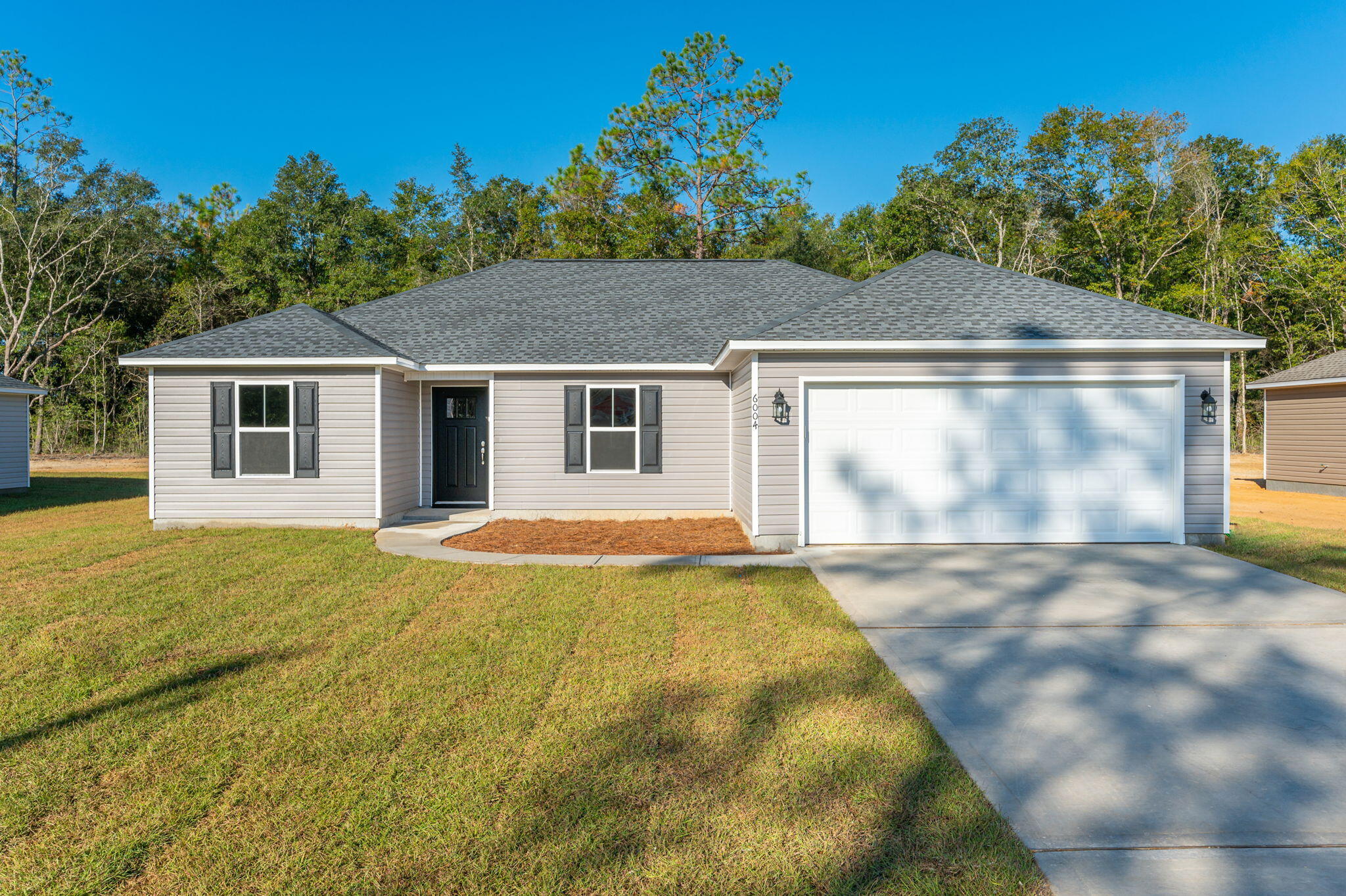 Seller will pay up to a total of $8,000 to close! Solid wood cabinetry, granite kitchen counter tops. ALL flooring Luxury vinyl throughout. Open floor plan with split bedroom, spacious guest bath, nice master bath with dual sink vanity, soaker tub as well as separate shower. Nice walk-in closet, inside laundry. Patio on rear. This is an energy efficient home close in, but outside city limits so lower taxes. Nice, neutral, popular decor. Sod will be front, partial side and back, total of 14 pallets. Appliances will include a Micro-hood, solid surface Range, self-cleaning, and dishwasher in stainless steel.  Great location that is convenient to Elgin AFB, Niceville as well as Crestview.Photos are of completed home, same plan.Please call LA for addm when asking builder to pay closing.