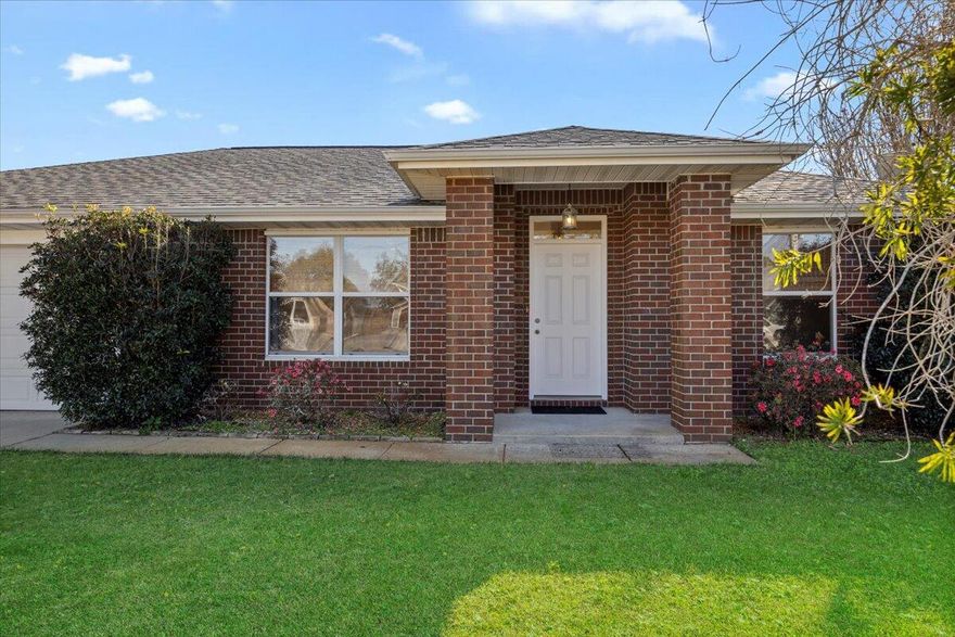 This beautiful custom-built home is situated in a peaceful cul-de-sac south of Highway 98, within a desirable, charming neighborhood that has no HOA. It features fresh interior paint, and brand-new carpeting in the living areas and bedrooms. The great room and kitchen boast striking cathedral ceilings, while the all-brick exterior adds timeless appeal. The kitchen is outfitted with custom cabinetry, granite countertops, a breakfast bar, and a formal dining area.Outside, you'll find a spacious backyard with a new fence, various producing fruit trees, and a large patio ideal for entertaining. The split floor plan includes a spacious master bedroom with a generous walk-in closet. The master bath is equipped with a double vanity, garden tub, and separate shower. The property also offers a convenient two-car garage.

This home is perfectly located for military members, with a short drive to Naval Air Station Pensacola and Hurlburt Field. It's also just minutes from the popular Navarre Beach, as well as great restaurants, theaters, and shopping in Pensacola, Gulf Breeze, and Navarre.