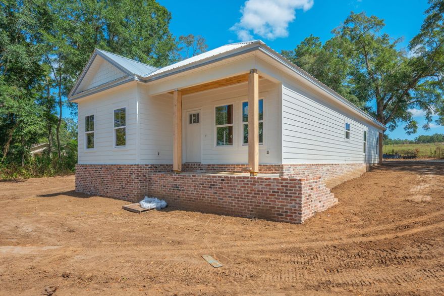 NEWv3-BR 2-BA open floor plan concept offering laminate and tile flooring, granite countertops, along with great appliances and a metal roof! Alabama allows you the opportunity to buy with lower insurance premiums and lower taxes! This home is low maintenance and has all the upgrades you are looking for in new construction to include amazing kitchen cabinets and granite countertops and offers an open kitchen/living concept adding to the openness of the home perfect for entertaining. Home is a split floor plans and includes a great master suite with a walk in closet and large master bath. Large covered porch welcomes friends and families and home also offers a great rear attached garage plus patio. Call today to see this GREAT buy! Just blocks from Lake Jackson.