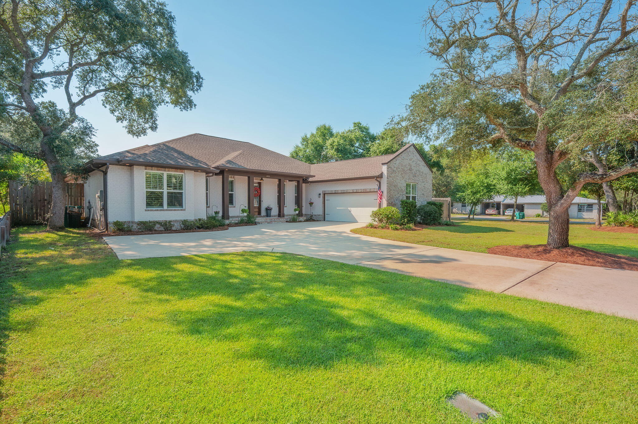 One level 2020 build brick beauty situated on an oversized corner lot in the heart of west Destin. Custom pool installed in 2022 and custom hot tub added in 2025. Enjoy the multiple parks in the area to include Joe's Bayou boat launch less than 1 mile away. You will find the luxury of a jack and jill bathroom, two oversized walk-in primary closets, soaking tub, dual shower heads, custom built in office, oversized laundry room, and countless custom upgrades throughout. The home is complete with two fireplaces, one in the living room as a beautiful focal point and the second nestled in the back porch, perfect for our amazing fall and winter nights. The home has LVP and tile throughout, a custom bar closet with built in wine fridge and under counter ice maker. Step into the oversized garage that can accommodate two cars and then some. The attic is spacious with head room and pull-down stairs. The 8ft privacy fence is perfect for backyard get togethers around the pool after a great day out at Crab Island. You'll be able to park your boat in the spacious spot behind the double gate or on the oversized driveway as this home has NO HOA. Contact your favorite agent to come see the luxuries for yourself.