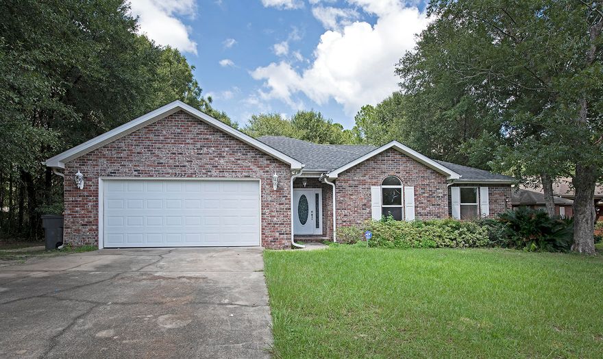 Beautiful all brick 4 bedroom home on a large lot with freshly painted interior! Large great room is accented with crown molding and columned foyer entrance. This split bedroom floor plan offers plenty of space and is very open and bright. The beautiful open kitchen is great for entertaining and overlooks the living and dining areas. The master bed features an ensuite bath with large master bath with garden tub, separate shower, and dual vanity sinks. Large master bedroom offers a walk-in closet, plenty of space for a king sized bed, and a sitting area. Deck provides the perfect place forgrill and overlooks the woodsy backyard.
