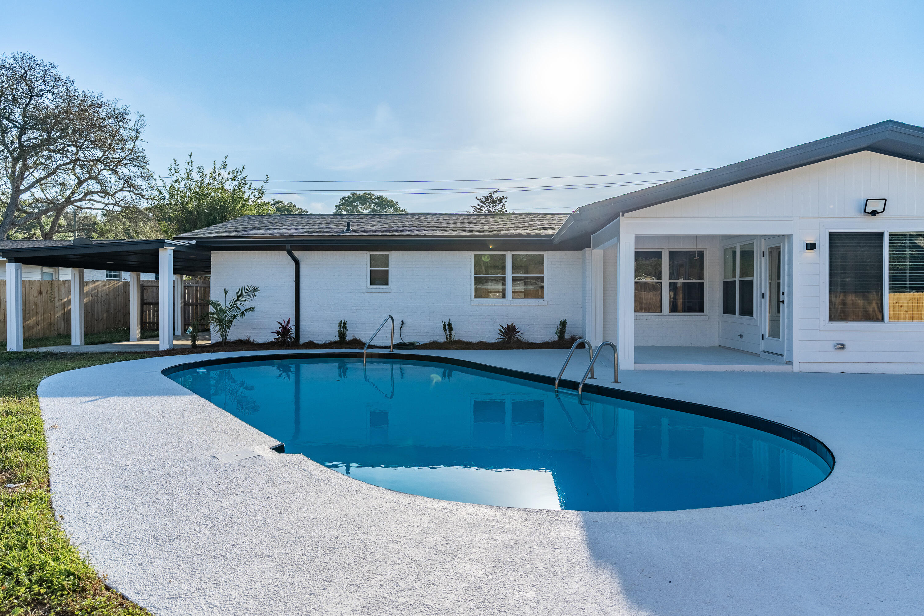 Show-Stopping Renovation with Pool & RV Pad - Kenwood Neighborhood!This home has been fully updated from top to bottom, including a brand-new roof, tankless water heater, new electrical throughout, Brand new kitchen & bathrooms, luxury vinyl plank flooring throughout, new doors and trim, modern lighting, and newer vinyl double-pane windows. The heart of the home is a gorgeous custom kitchen featuring quartz countertops, soft-close cabinets, all-new appliances, a redesigned layout, and a hidden walk-in pantry--perfect for entertaining or everyday living.Enjoy a spacious split floor plan with a private master suite offering a walk-in shower, dual vanities, and large walk-in closet. Three additional bedrooms are located on the opposite side along with two versatile flex spacesideal for a second living area, home office, dining room, or playroom.
Step outside to your private backyard oasis complete gunite pool  with a freshly painted and deck, covered patio, full irrigation system, and privacy fencing. There's even a dedicated RV pad with 220 amp service, double gate access, and a private rear carportideal for extra parking, boat storage, or a workshop.  Just 5 miles from Hurlburt Field, Eglin AFB, and the white-sand beaches of Okaloosa Islandand minutes from shopping, dining, schools, medical centers, and entertainmentthis location offers both convenience and charm. This home has it allstyle, space, location, and a backyard built for Florida living, Call for your viewing today!
