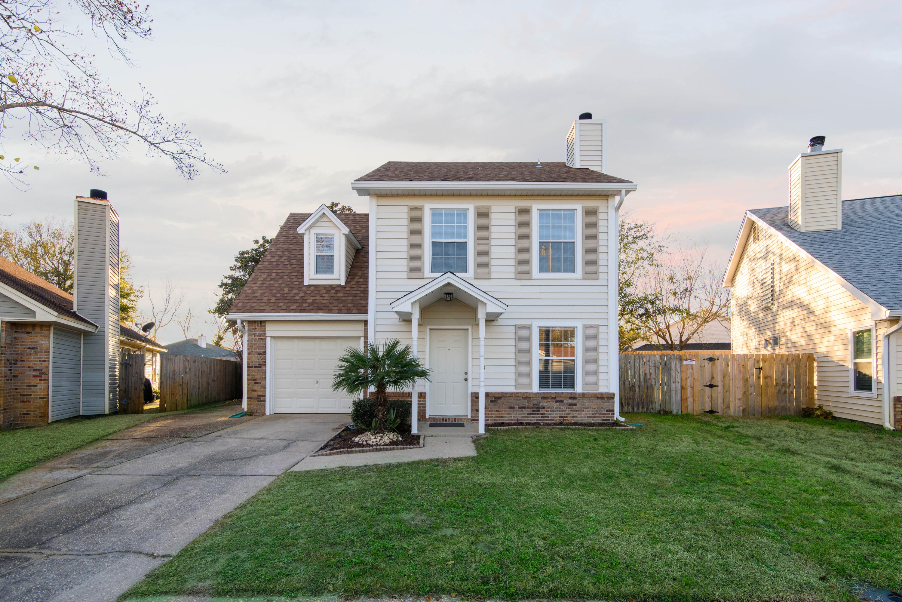 MOVE-IN Ready beautiful 3 Bedroom, 2 1/2 Bath home with a 1 Car garage just ONE MILE from Hurlburt Field. This house is located in a well-established, quiet neighborhood that is great for families. Don't let the age fool you this owner has done many renovations to include Brand NEW ROOF, INSULATED VINYL SIDING, Tile throughout the first floor, laminate flooring in all 3 Bedrooms, whole house re-plumbed with a PEX PLUMBING SYSTEM, 2013 50 Gal. WATER HEATER, 2017 HVAC, and fresh paint throughout!Upon entering you will be welcomed by the well-designed large living room that features a wood-burning fireplace and tiled floor. Towards the back you will see a spacious eat-in kitchen with stainless steel appliances and 2 pantries.