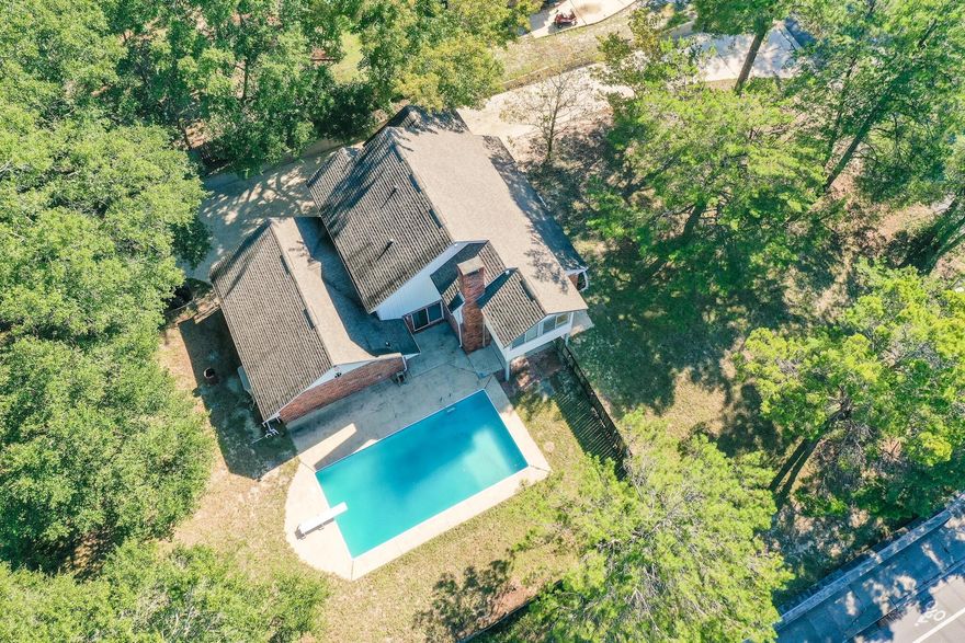 Nestled on nearly half an acre this residence is located in the desirable Rocky Bayou community, featuring a private pool and Bayou views. Charming and unique, this home offers three bedrooms, two and half baths, and an additional bonus room that would make an ideal office, playroom, or even FOURTH bedroom. Equipped with an oversized driveway providing ample room for dual boats and/or RV parking, with NO HOA!  Enjoy tranquil Bayou views from the living and dining area with ample windows providing an abundance of natural light. Stay cozy in front of the stone wood-burning fireplace or watch your guests splash in the large resort-style pool from the eat-in kitchen. Notable features include: keyless front entry, solid wood double front doors, energy efficient Nest thermostat, large private fenced-in backyard, 16x32 in-ground pool, oversized two car garage, open floor plan, and gorgeous Bayou views from the second floor master suite sunroom. Rocky Bayou is conveniently located in close proximity to the nearby boat ramp, military bases, award-winning schools, eateries, shopping, and the beaches in Destin - 30A are just over the bridge!