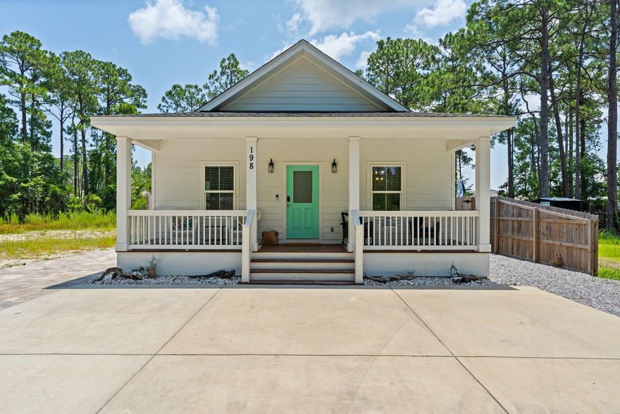 Welcome to 198 1st St. This high quality 3BR/2BA home is beautifully maintained & being sold fully furnished & well equipped...making it ideal as a vacation rental, second home, investment property, or full-time residence. Currently operating as a successful short-term rental, the home features tasteful coastal decor, hardwood floors throughout & a modern kitchen with stainless steel appliances, quartz countertops & beautiful tile backsplash. Enjoy the Florida lifestyle with three spacious porches, perfect for coffee, cocktails, or catching a breeze. Out back, unwind in your own private oasis complete with a tiki bar, lounge area &  hot tub. The no-maintenance yard is fully paved and accented with coastal shell landscaping, giving it a clean, beachy vibe with zero hassle. Other highlights include ample parking for guests, boats, or multiple vehicles, no HOA, and an X flood zone location, meaning no flood insurance is required. Located less than a mile from Cessna Landing Park with public boat ramp access & just minutes to Ed Walline Beach Access at Gulf Place, you'll have quick access to both the bay and the Gulf. Whether you're looking for your own personal retreat or a smart, income-producing investment, this home delivers on all fronts: turnkey, stylish, no restrictions & packed with potential. Don't miss your opportunity to make this rare gem yours!