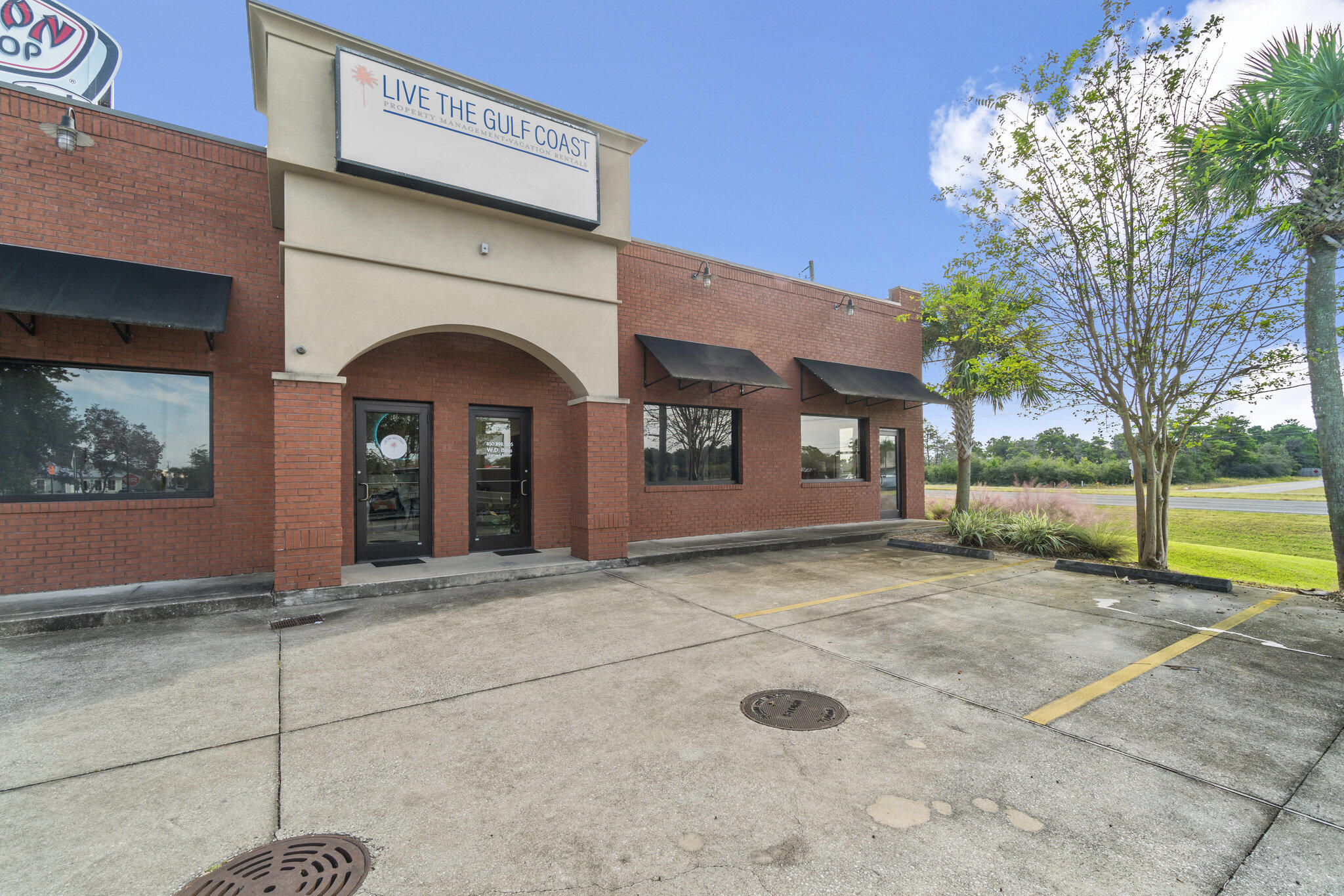 This office space is located near the Inlet Beach area and includes a reception area and two offices. There is a shared conference room, two bathrooms, kitchen suite with sink, dishwasher, refrigerator and small eat in area. This space is shared with the owner of the building that houses a vacation rental management company and real estate team of aDoor Real Estate. Some lighted signage space is available. Tenant is responsible for purchase of signage and installation and must be approved by owner prior to installation.