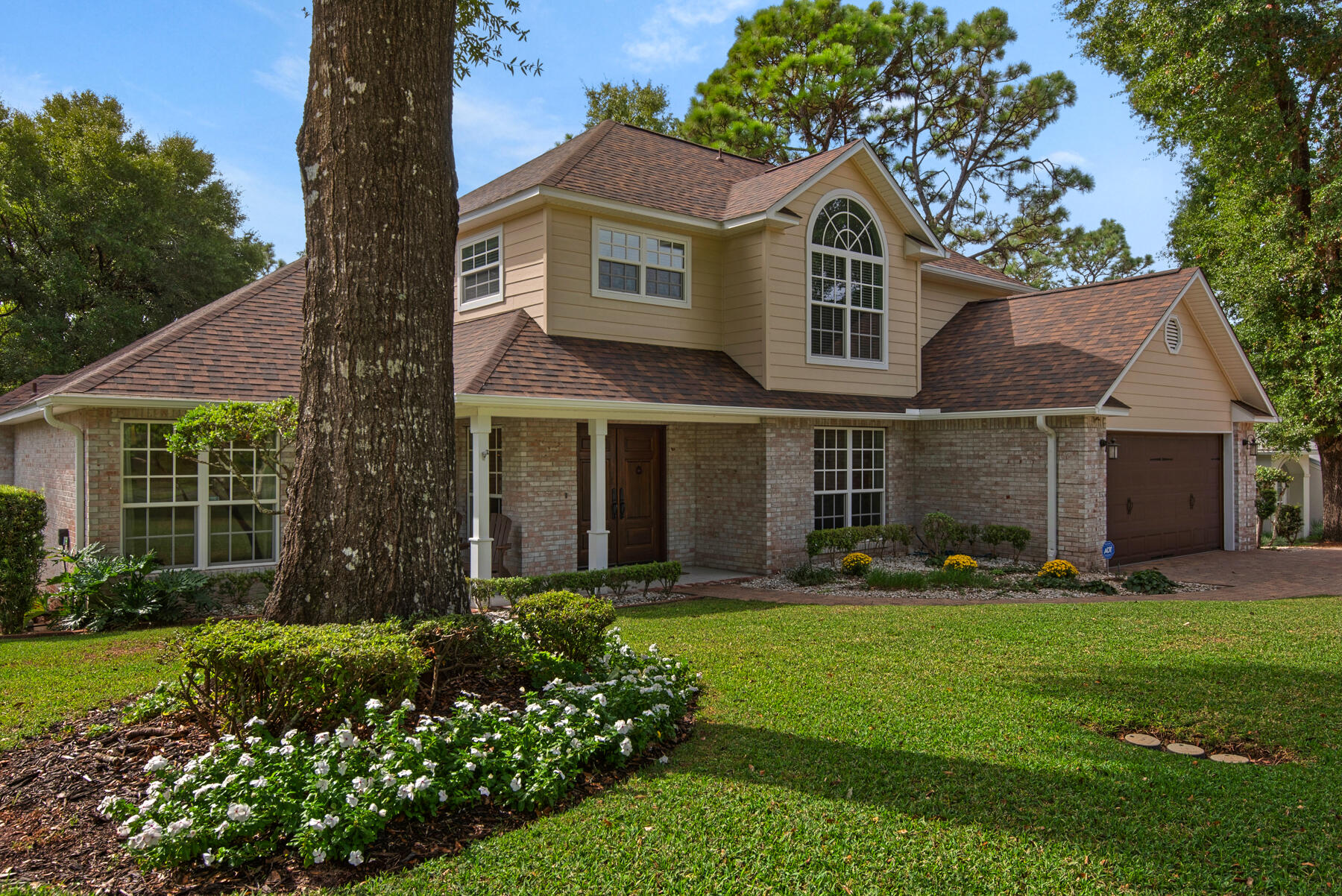 Are you looking for a beautiful home in which to make wonderful memories? 2181 Chase Drive has everything you could possibly need to make that happen. From the moment you approach the property - it is hard not to take in the beautifully landscaped yard and curb appeal of this home. When you see the beautiful paver driveway, brand new 2025 roof, fresh paint and the gorgeous custom double wood front doors you will be definitely want to see more. Stepping into the home you are greeted by hard wood floors and an impressive vaulted ceiling in the living area. Large windows throughout the home bring tons of natural light in every space. This chef's kitchen boasts a sub zero refrigerator, gas cooktop/oven and bar counter for those who want to keep you company while the chef of the family cooks. The luxurious master bath has been completely remodeled with a gorgeous soaker tub, walk-in shower, custom built-in vanities, custom master closet, and heated floors make getting ready a pleasant experience for sure. Upstairs has three more bedrooms, a full bath and an open loft which overlooks the living area. Back downstairs - open the triple sliders into the relaxing and impressive screened/glassed back porch which overlooks the pool - the wood finishes, gas lanterns, a gas fireplace and the privacy of the wooded back yard give this room a cozy, elevated feel. Or, if you prefer to sit outside - the large deck will accommodate the whole family. There is room for a jacuzzi, an outdoor kitchen and is perfect for entertaining. The 18x38 pool has travertine decking and is such a beautiful focal point in the backyard. There are several areas to relax around the pool and enjoy your peaceful surroundings. There is a green space behind this property - so no backyard neighbors! Don't miss the almost 300 sqft of heated and cooled space under the porch...so many uses for this area - it could be an office, fantastic homeschool space or pool hang out area. Items of note: Roof 2025, HVAC 2022, 2011 tankless water heater and whole house generator.