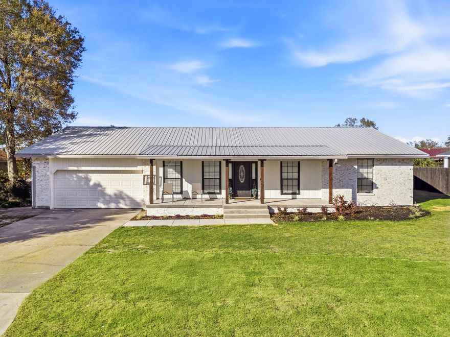 Set along deep, navigable waters leading into North Bay, this beautifully renovated three-bedroom, two-bath residence marries timeless coastal living with unmatched value as the lowest-priced updated home offering true deep water access. Free from HOA restrictions, the property delivers both freedom and lifestyle in one rare package.The thoughtfully redesigned interiors highlight craftsmanship and modern convenience throughout. An open-concept layout invites effortless entertaining, anchored by an oversized dining area with serene water views. The custom kitchen features a substantial island, refined finishes, and exceptional functionality -- ideal for casual gatherings or elevated dining. A dedicated office and spacious laundry room enhance the home's practical design.