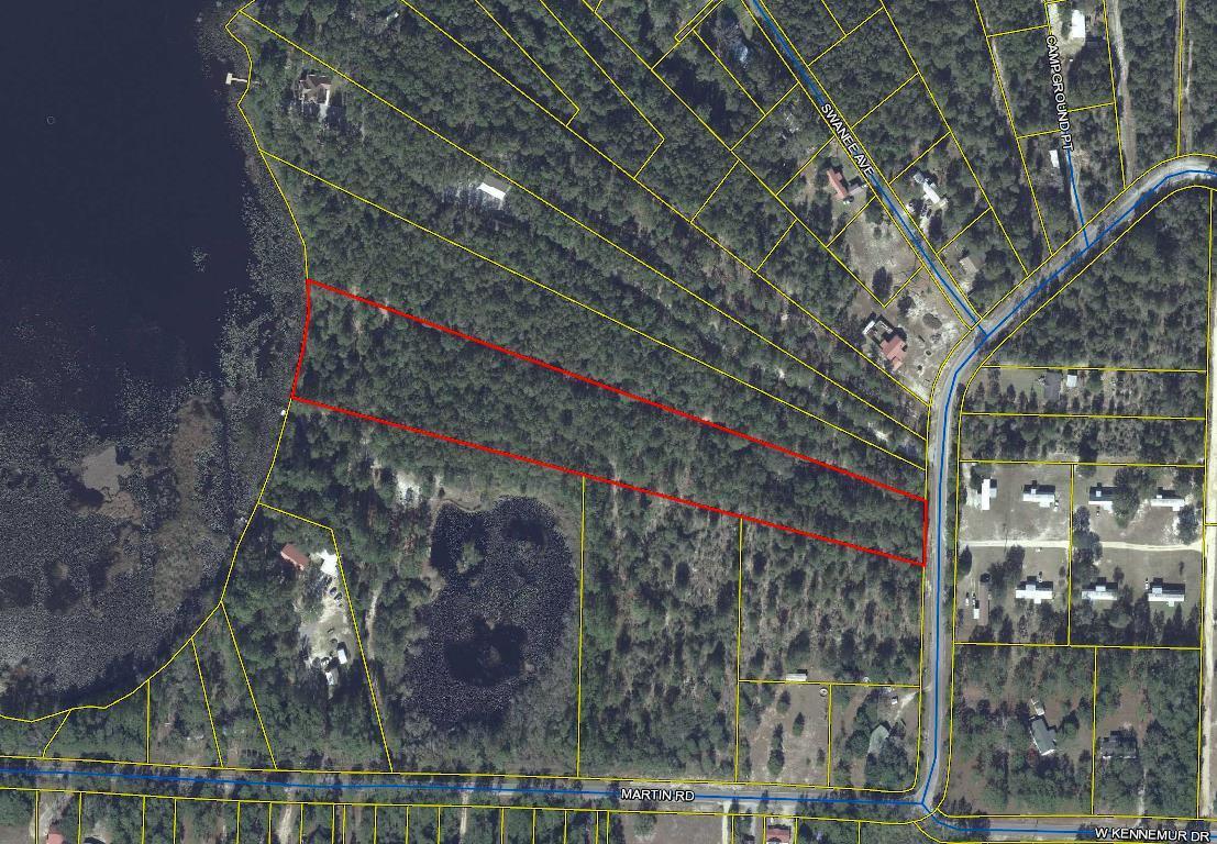 Come build your dream home on this beautiful track of land. This 4.5 acres has 200+ feet of waterfront on Lake Holley. This large lot is located on a paved road close to town. City water is available. Survey is located under documents.