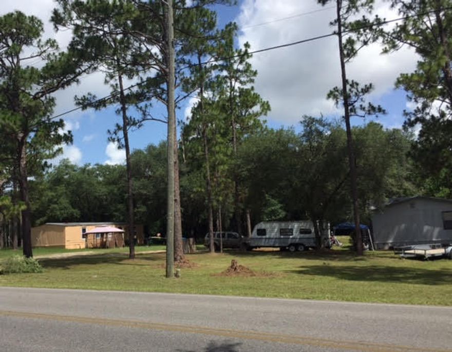 This is a fantastic investment opportunity with an amazing CAP rate! The property includes 4 platted lots zoned residential but in use as a trailer park. Please note that the square footage is for all three buildings combined. 2961 Aplin is a single family 2 bedroom, 1 bath home (780 sqft) renting for $450. 2965 Aplin is a 3BR/2BA mobile home (1200 sqft) renting for $550, and 2969 Aplin is a 3BR/2BA updated mobile home (1329 sqft) with laminate flooring and a new tub renting for $700. Seller recently purchased a new septic motor and electric pole. Your tenants will be ecstatic to rent in such a convenient location!