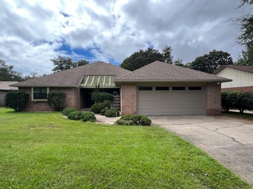 Spacious 3/2/2 Brick Home in Bluewater Bay with Bonus Room & Screened porch!  Great Potential! Close to Schools, Bases, Beaches and Shopping!  This is a quality home, but it needs paint throughout.  The only carpet is in bedrooms & all other flooring is tile and engineered hardwood. The carpet needs to be replaced.  Please respect that this is an estate, sold AS-IS and sellers will not make any repairs. The home is in generally good condition other than carpet and wall/ceiling paint.  The Living room is spacious with Engineered Hardwood flooring and a wet bar; The Living Rooms adjoins a formal dining room and a Fabulous Screened Porch!  The Kitchen has Updated Maple Cabinets, Solid Surface (Quartz composite) counter tops, Glass-Top/Self Cleaning Range, Refrigerator with Icemaker and newer dishwasher.  The Master Bedroom is nicely sized with a walk-in Closet.  The Master bath has an extra long Double Vanity (with lots of storage!) and a separate area for the toilet and updated Cultured Marble step-in Shower.  The two Guest Bedrooms both have walk-in closets.  The Guest bath has a shower/Tub combo and vanity.  There are two large linen storage cabinets in the hallway.  The Laundry Room is located inside between home and garage.  The Bonus room is behind the Living Room and adds to the living space. The beautiful back yard has a storage building and sprinkler system. The garage is 21x22 with a workbench and pull-down stairs to the attic.  There is a quaint, fenced courtyard in front.  Windows have been updated to Vinyl (approx 2019) and there are roll up storm shutters. There are Several Permits are on file.  Most windows were updated in 2019 and there is a reference to a roof inspection in that same permit. HVAC and Water heater are older but are working well.  This home only needs a few cosmetic updates (wall/ceiling/baseboard paint, carpet etc.) to be back in its Glory!  A video is available.