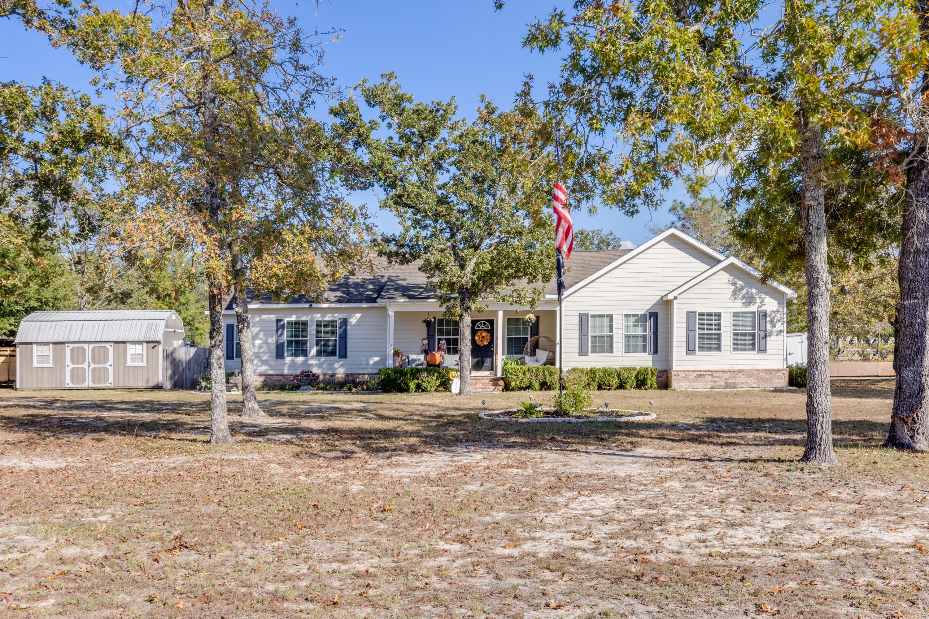 Welcome to this delightful 3 bedroom 2 1/2 bath farmhouse style home, nestled on a spacious corner lot over an acre. Spanning 2366 sq ft, this home exudes country warmth with an inviting open-concept layout that's perfect for modern living. The kitchen features all new appliances, while archways throughout add a touch of elegance and character. With a cozy den ideal for a home office or library and a nursery off the master bedroom for growing families, the layout is both functional and flexible. Enjoy year round comfort thanks to the newly installed 2024 HVAC. Outside the expansive lot offers endless possibilities for gardening , chicken coops, and /or kids playgrounds, and the covered deck is ideal for year round entertaining.Plenty of room indoor & out!