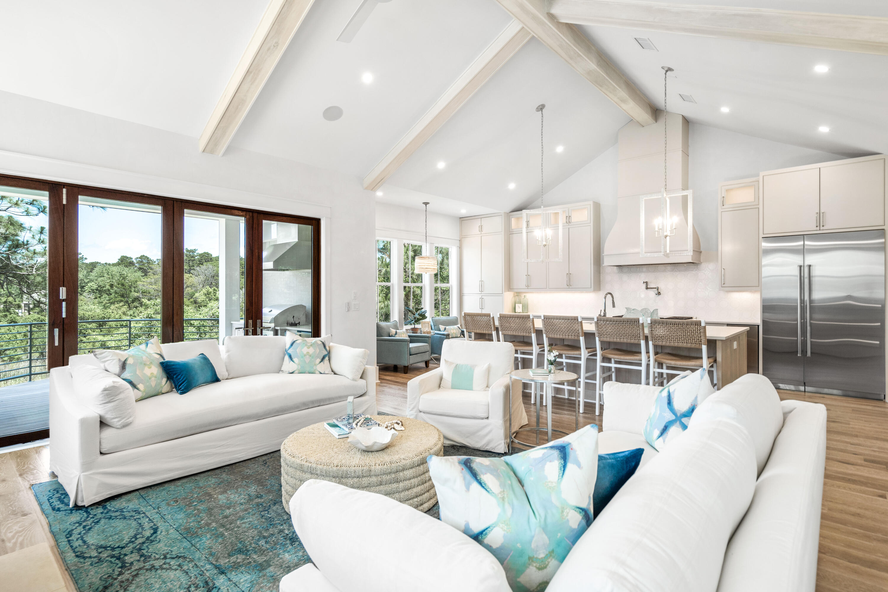 NEW CONSTRUCTION! This residence offers an unparalleled combination of privacy, luxury, and convenience! The home is 4 bedrooms plus office and 4.5 baths and includes 3,580 square feet of impeccably designed living space. Additionally, relaxing views of Camp Creek Lake and being nestled along a private street. It is just steps to the beach, the 30A bike path, numerous restaurants and shops. Upgraded finishes and features throughout include Venetian plaster, diamond pattern wainscoting, mitered and coffered ceilings, hardwood oak floors, textured wallpaper and an elevator that services all three levels. The property maximizes enjoyment of the peaceful views across the marsh to Camp Creek Lake from the oversized balconies. The open concept living and dining space, kitchen, guest bedroom which could easily be an office, powder room, and primary master suite are also located on the second level. The sleek and stylish kitchen is highlighted by a large center island, quartz countertops, Sub-Zero and Wolf appliances, and custom white cabinetry. The spacious living and dining area features vaulted, beamed ceilings, a gas fireplace, and bi-fold doors that slide open to enjoy the lake views from the porch. An outdoor fireplace, sitting area and summer kitchen make the porch the perfect place to relax. The master suite is stunning with an incredible ensuite featuring a tiled accent wall, separate soaking tub, walk-in shower, and custom double vanity along with his-and-hers closets and a private balcony. On the first level, there are two guest suites with ensuite bathrooms, a secondary living area and a large laundry room. The third level provides an additional guestroom or office plus a full bathroom. Store everything you need for coastal life in the two-car garage. There is an option for a Buyer to add a pool and photos are shown in listing. Camp Creek Cove is a boutique neighborhood of custom homes nestled at the end of oak tree lined Camp Creek S. Road. Sheltered from the activity of 30A, the home offers a rare sense of privacy and with the designer lighting, custom tiled bathrooms, and other features it cannot be missed!