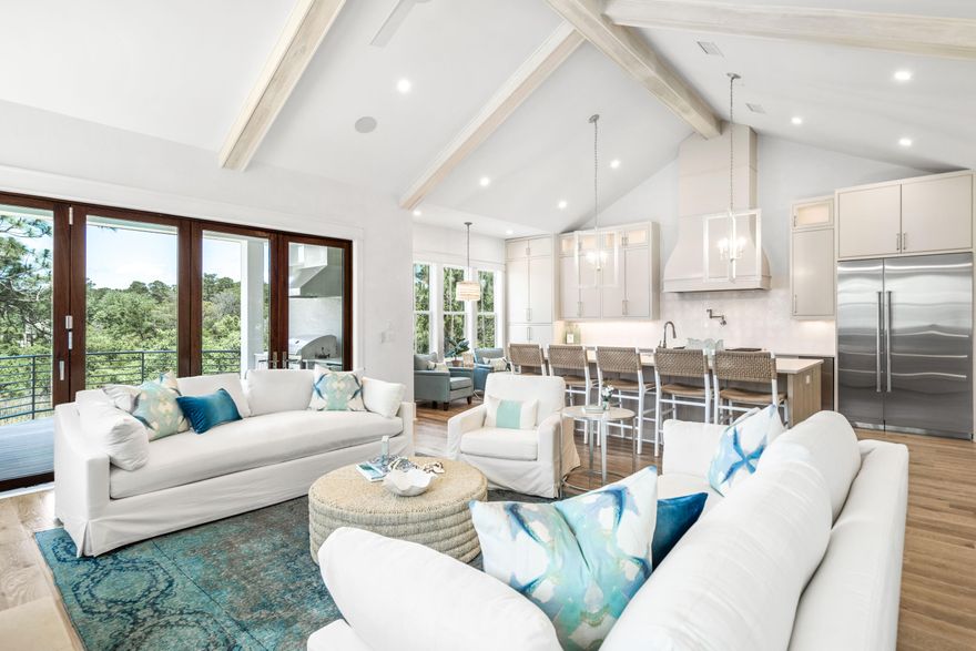 NEW CONSTRUCTION! This residence offers an unparalleled combination of privacy, luxury, and convenience! The home is 4 bedrooms plus office and 4.5 baths and includes 3,580 square feet of impeccably designed living space. Additionally, relaxing views of Camp Creek Lake and being nestled along a private street.   It is just steps to the beach, the 30A bike path, numerous restaurants and shops. Upgraded finishes and features throughout include Venetian plaster, diamond pattern wainscoting, mitered and coffered ceilings, hardwood oak floors, textured wallpaper and an elevator that services all three levels. The property maximizes enjoyment of the peaceful views across the marsh to Camp Creek Lake from the oversized balconies. The open concept living and dining space, kitchen, guest bedroom which could easily be an office, powder room, and primary master suite are also located on the second level. The sleek and stylish kitchen is highlighted by a large center island, quartz countertops, Sub-Zero and Wolf appliances, and custom white cabinetry. The spacious living and dining area features vaulted, beamed ceilings, a gas fireplace, and bi-fold doors that slide open to enjoy the lake views from the porch. An outdoor fireplace, sitting area and summer kitchen make the porch the perfect place to relax. The master suite is stunning with an incredible ensuite featuring a tiled accent wall, separate soaking tub, walk-in shower, and custom double vanity along with his-and-hers closets and a private balcony. On the first level, there are two guest suites with ensuite bathrooms, a secondary living area and a large laundry room. The third level provides an additional guestroom or office plus a full bathroom. Store everything you need for coastal life in the two-car garage. There is an option for a Buyer to add a pool and photos are shown in listing. Camp Creek Cove is a boutique neighborhood of custom homes nestled at the end of oak tree lined Camp Creek S. Road. Sheltered from the activity of 30A, the home offers a rare sense of privacy and with the designer lighting, custom tiled bathrooms, and other features it cannot be missed!